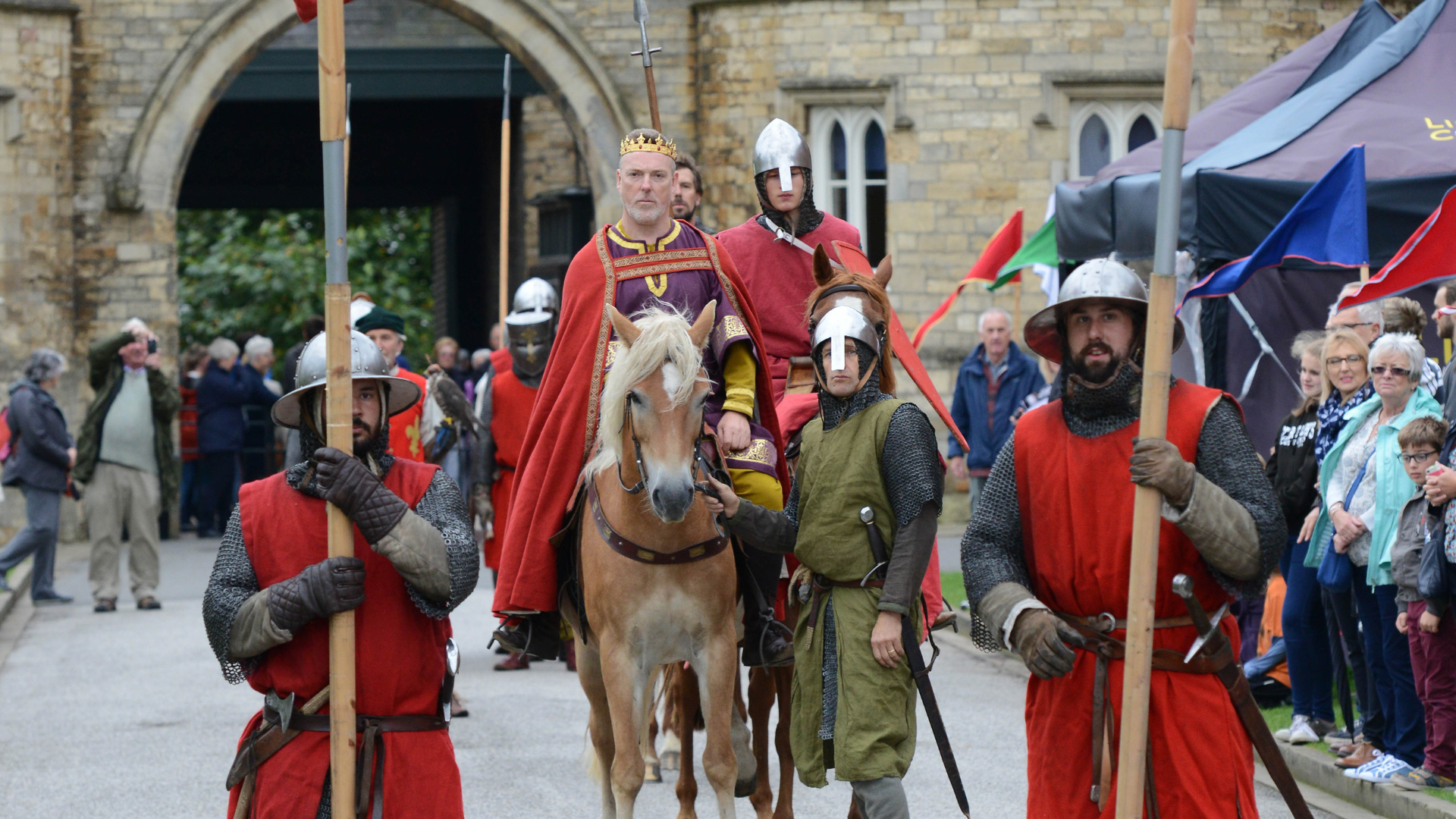 Medieval re-enactors a knight and soldiers