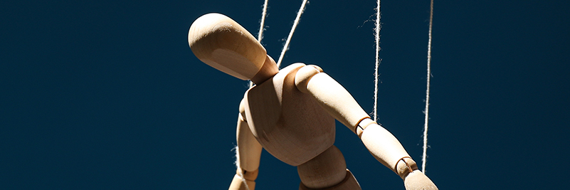Image of a puppet on strings