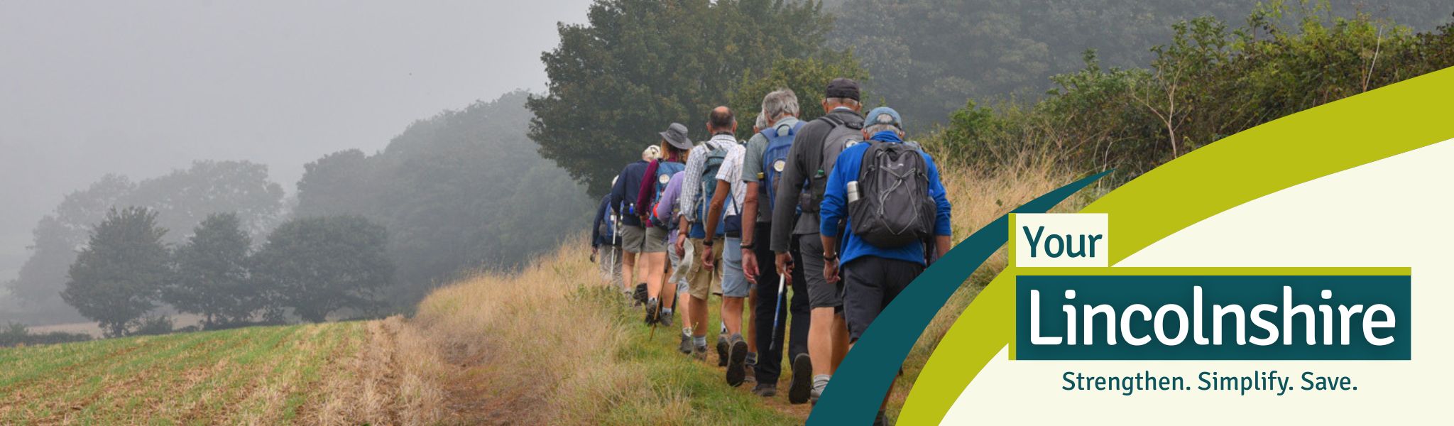 Walkers hiking through field on a public footpath. 

Your Lincolnshire logo