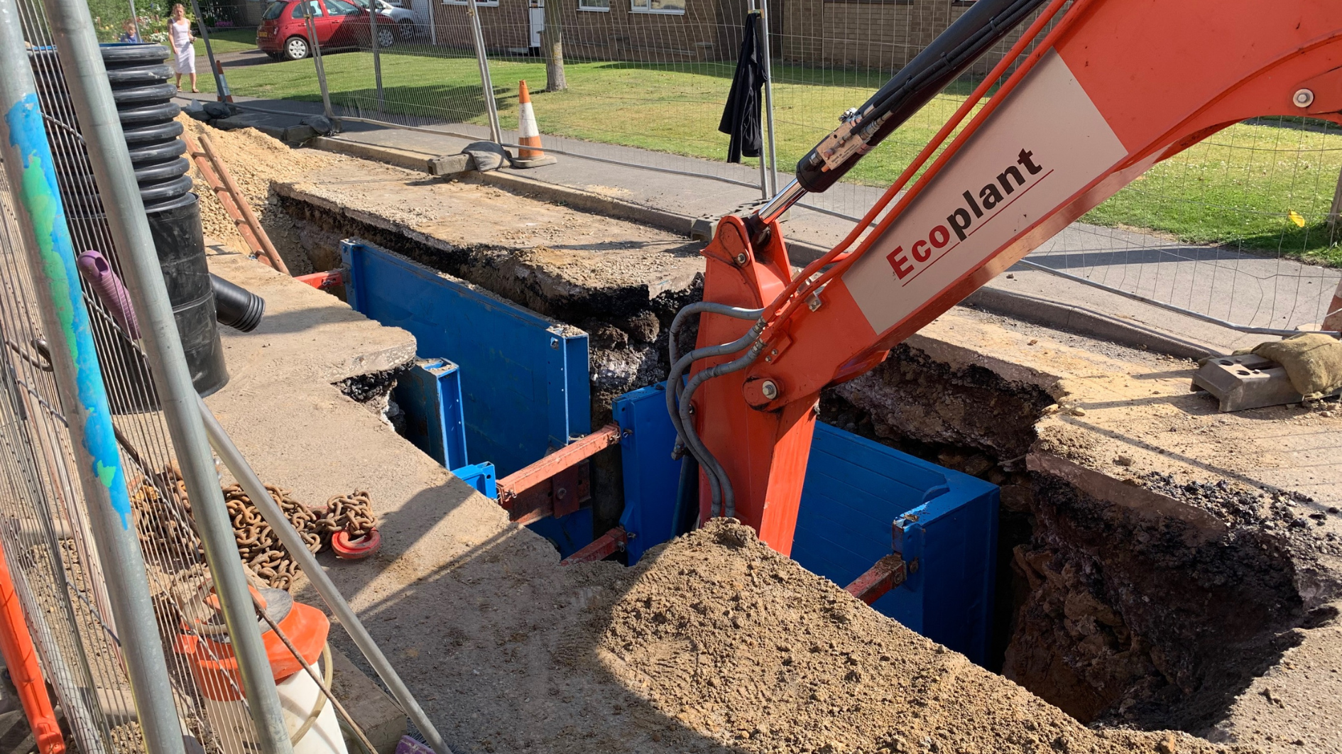 The drainage project saw a new, wider pipe installed under the road