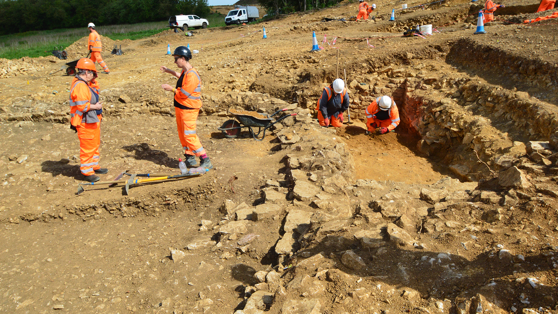 An image of Roman walls uncovered on the site of the upcoming new road near Grantham. A number of achaeologists in high vis are at work.