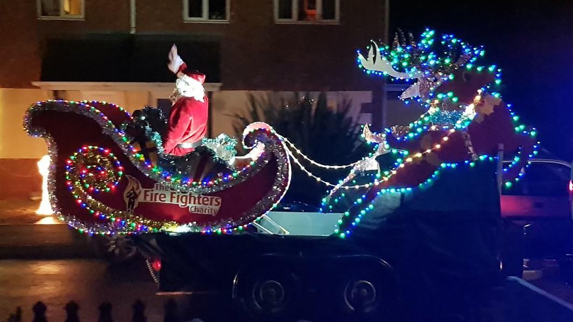 A fire service Santa Sleigh at night