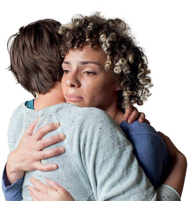A woman comforting another person