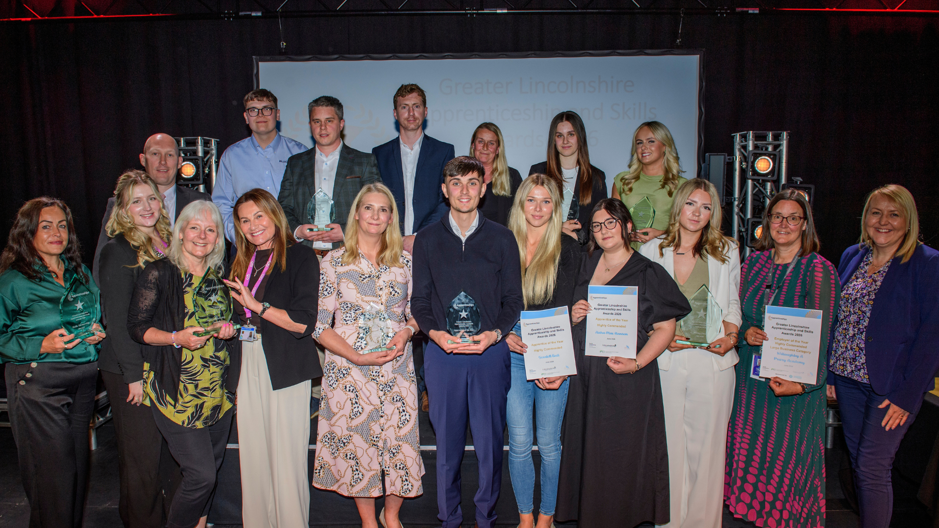 All award winners and highly commended nominees on stage posing with awards and certificates