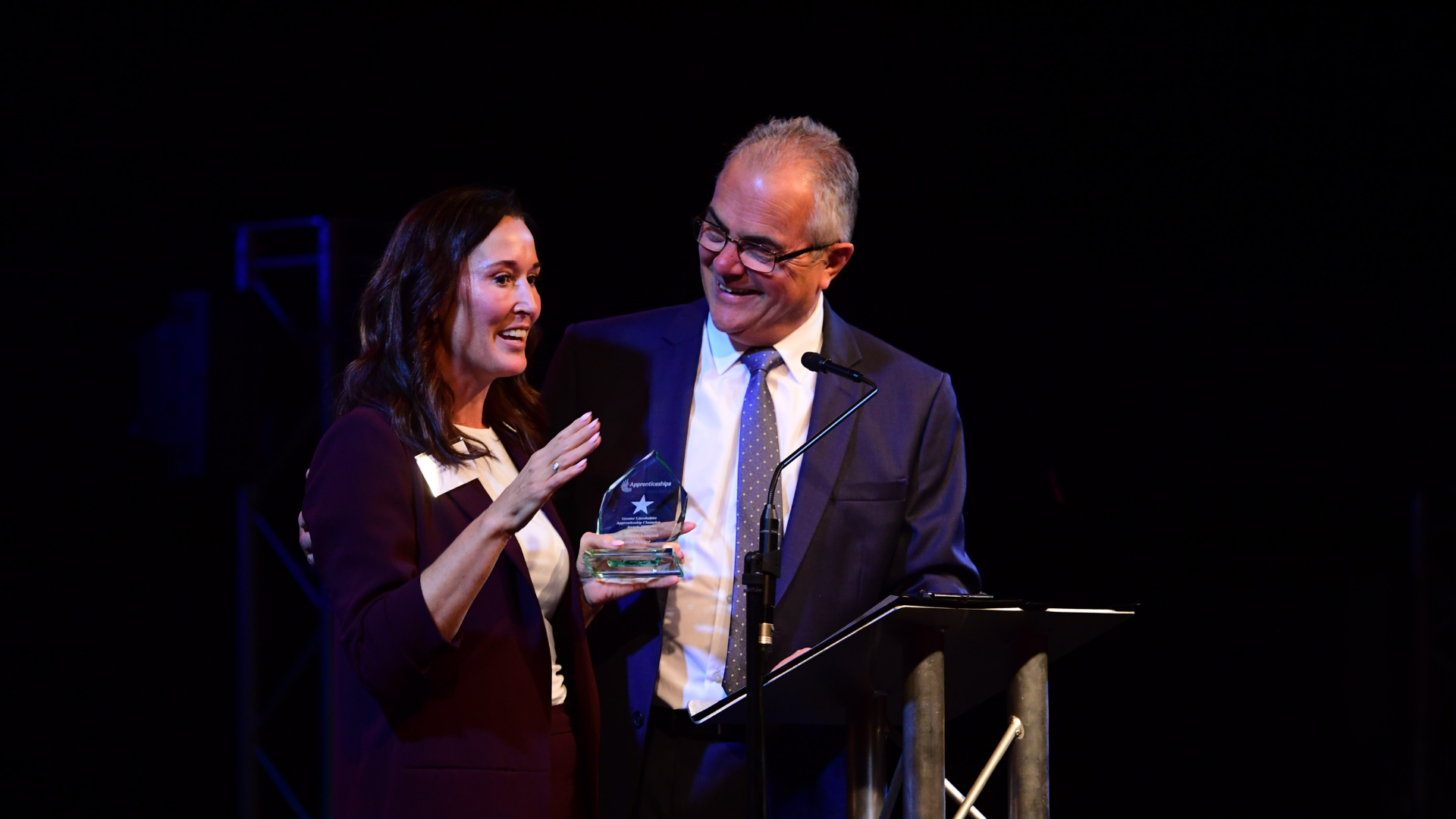 Mel accepting award from host Melvyn