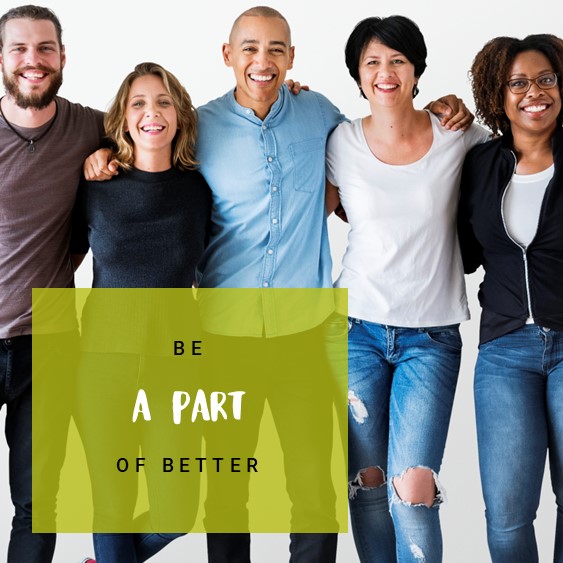 A group of people stood together smiling