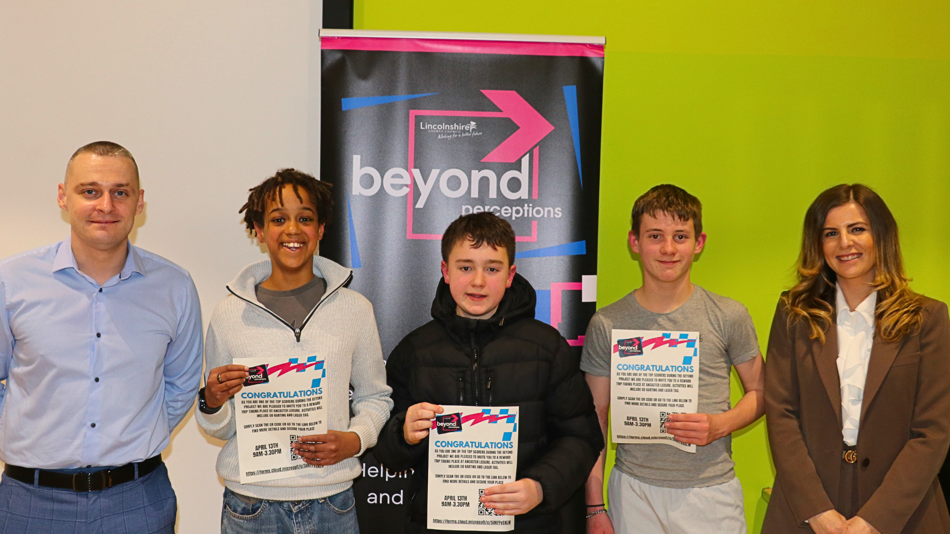 Cllrs Alex McGonigle and Natalie Oliver present certificates to young people in Louth