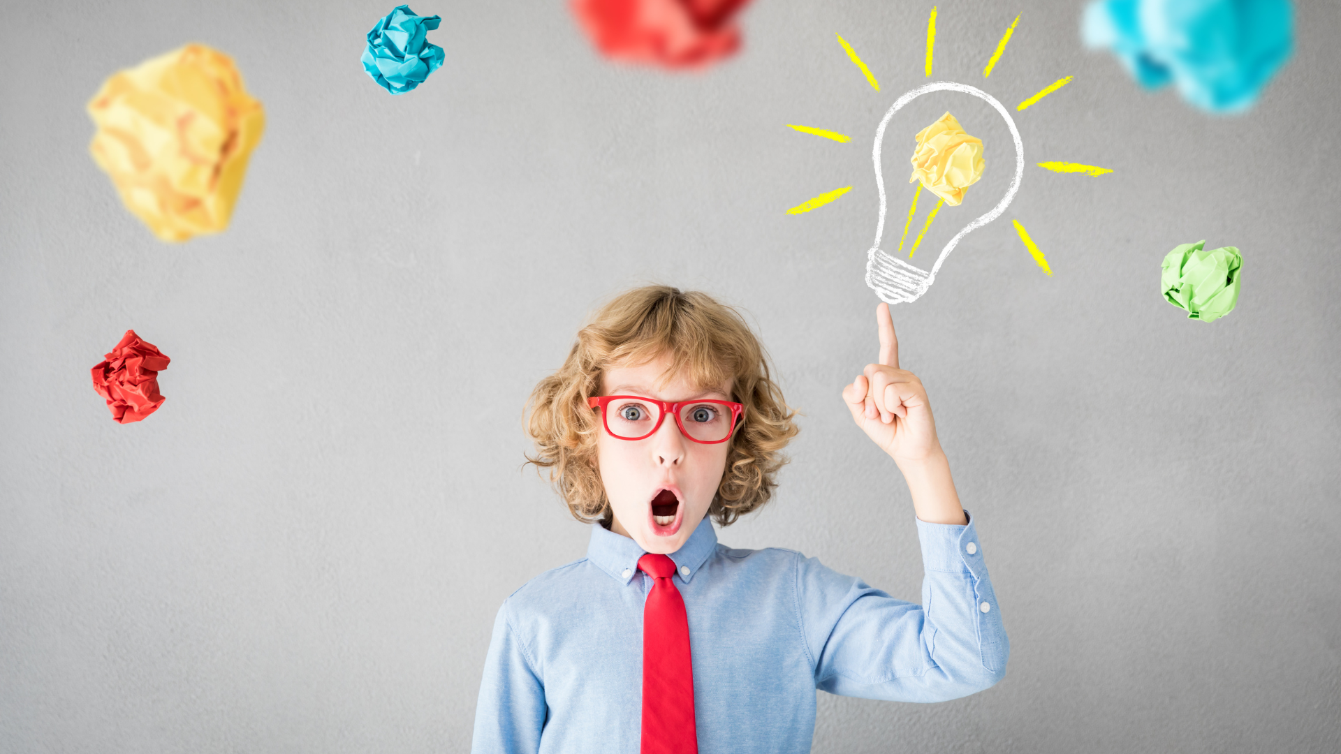 Young boy with light bulb graphic above his head