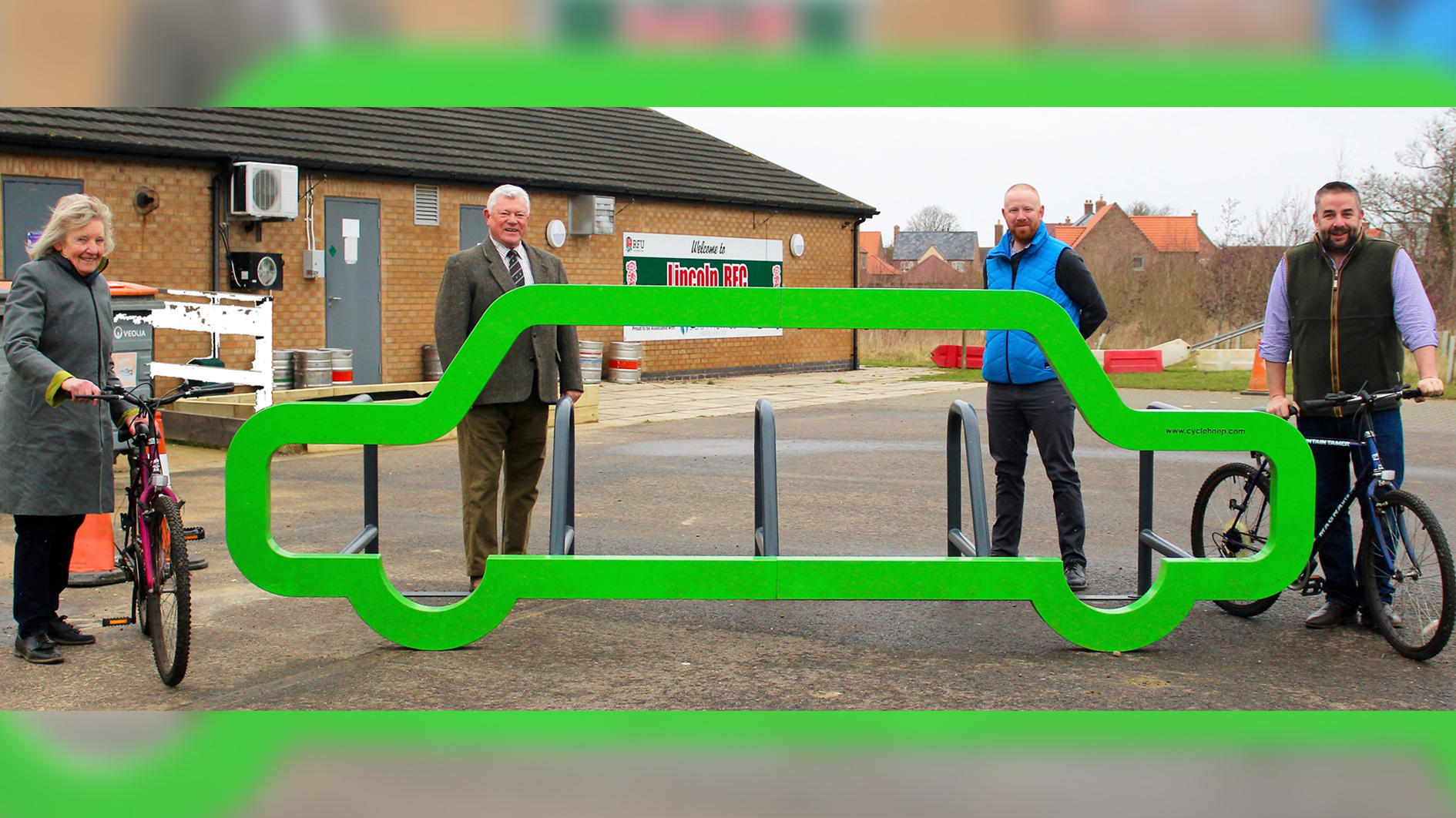 Cllr Richard Davies, LCC cycling officer Phil Watt, club chairman John Barrett, and WLDC Cllr White with the new cycling rack at Lincoln Rugby Club.