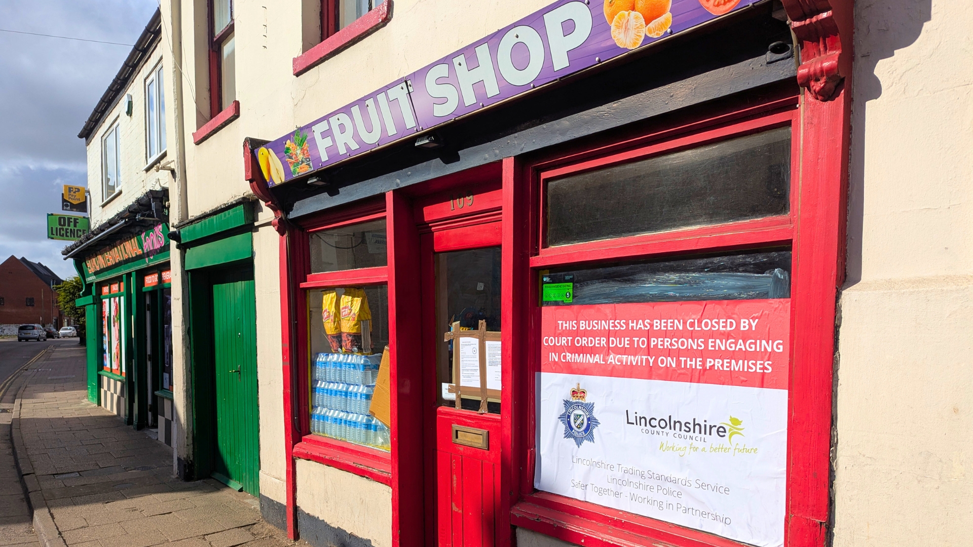 Fruit Shop in Boston. A Lincolnshire Trading Standards and Lincolnshire Police sign in the shop window reads "This business has been closed by court order due to persons engaging in criminal activity on the premises"