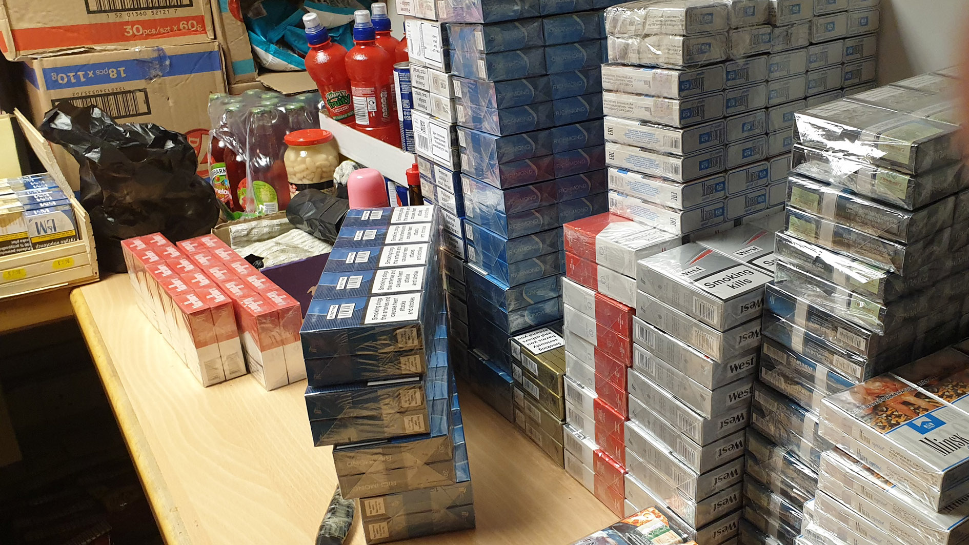 Boston shop raid - stacks of illegal cigarettes