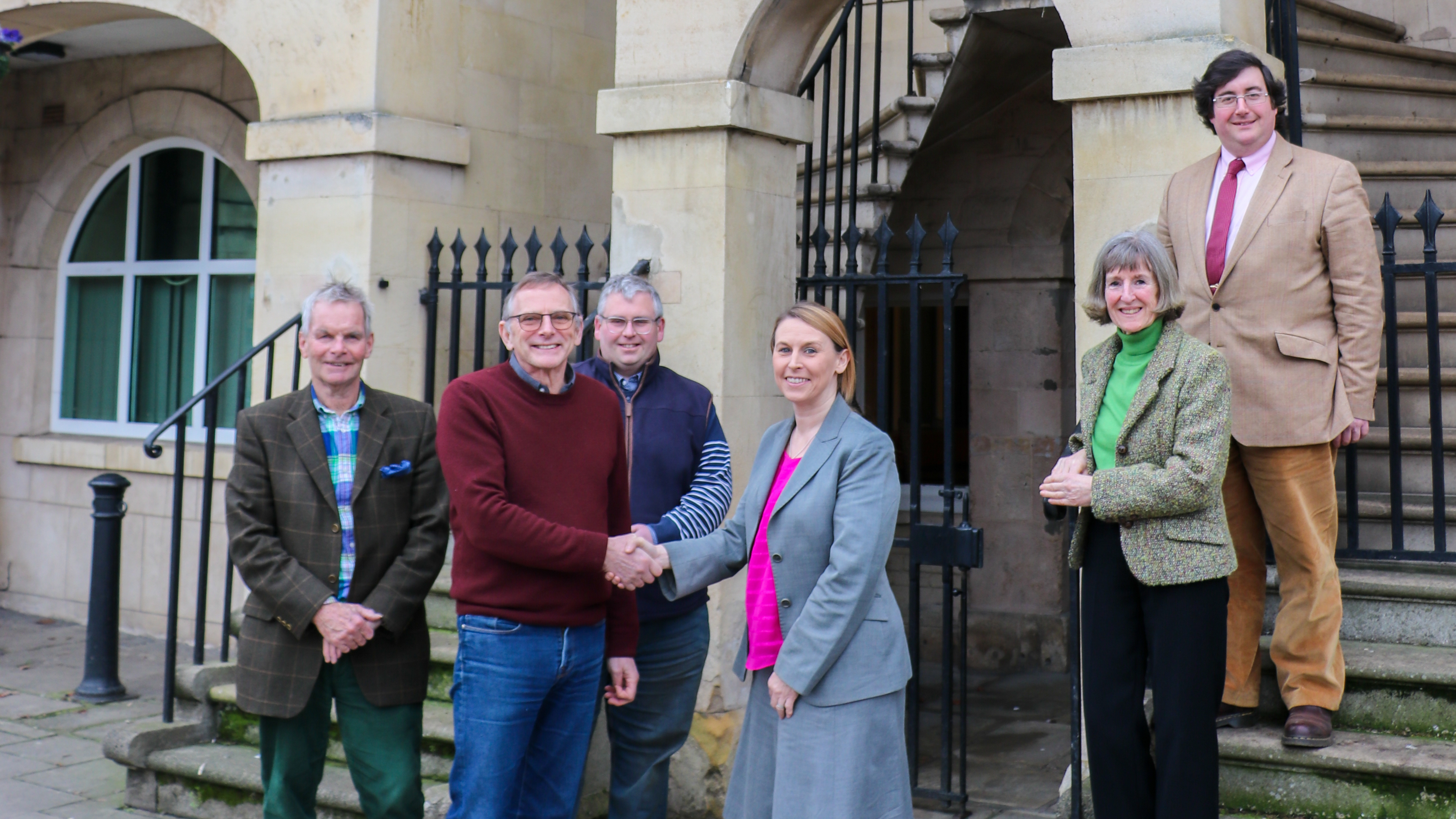 Members of the Bourne Town Hall Management Committee hand the building over to the Town Hall Trust.