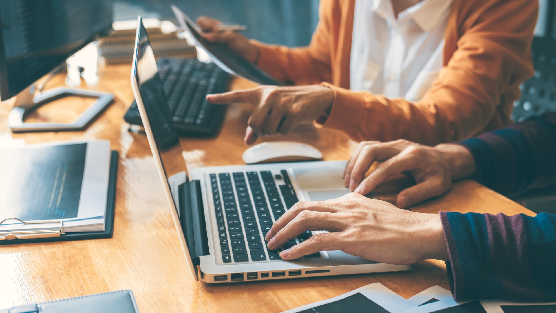 People at laptops typing