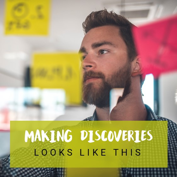 A man smiling with text reading &#039;making discoveries looks like this&#039;