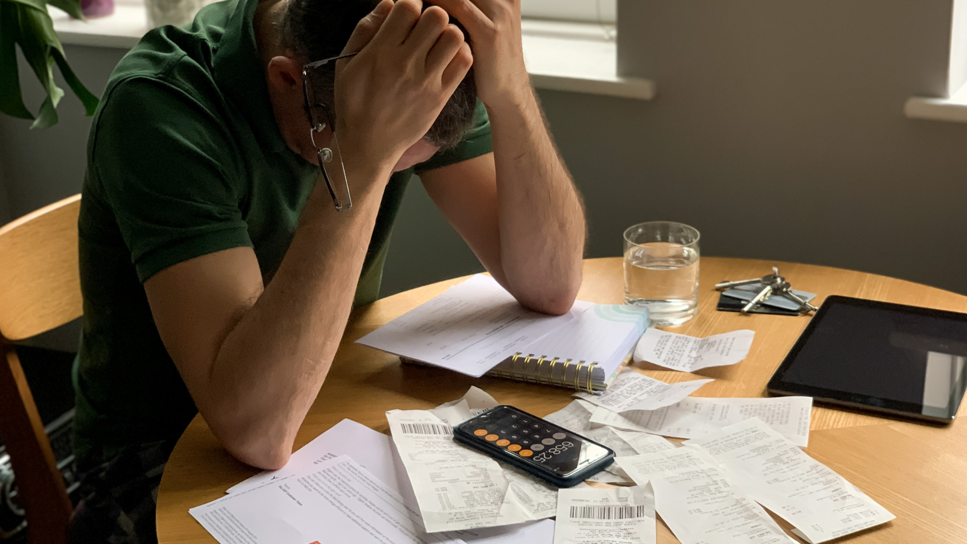 Worried man looking at bills