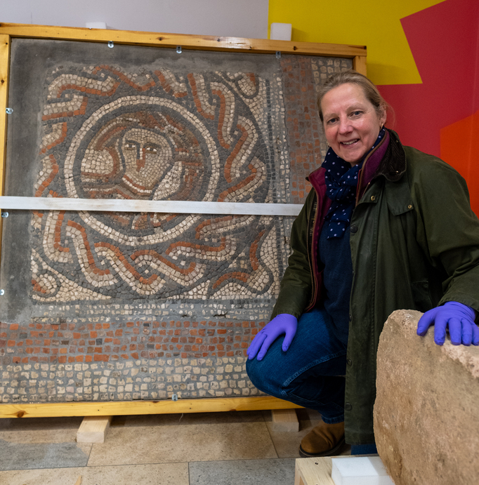 Cllr Lindsey Cawrey pictured with a Roman mosaic at Lincoln Museum.