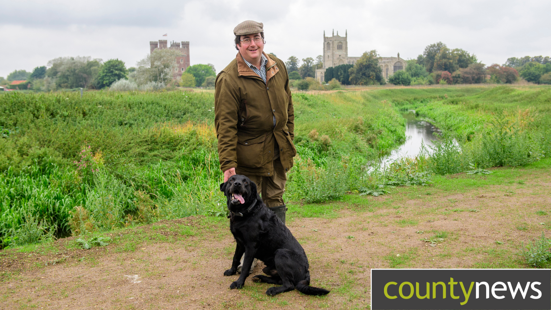 Cllr Ashton and his dog Jack at the scene of the repaired banks of the River Bain.