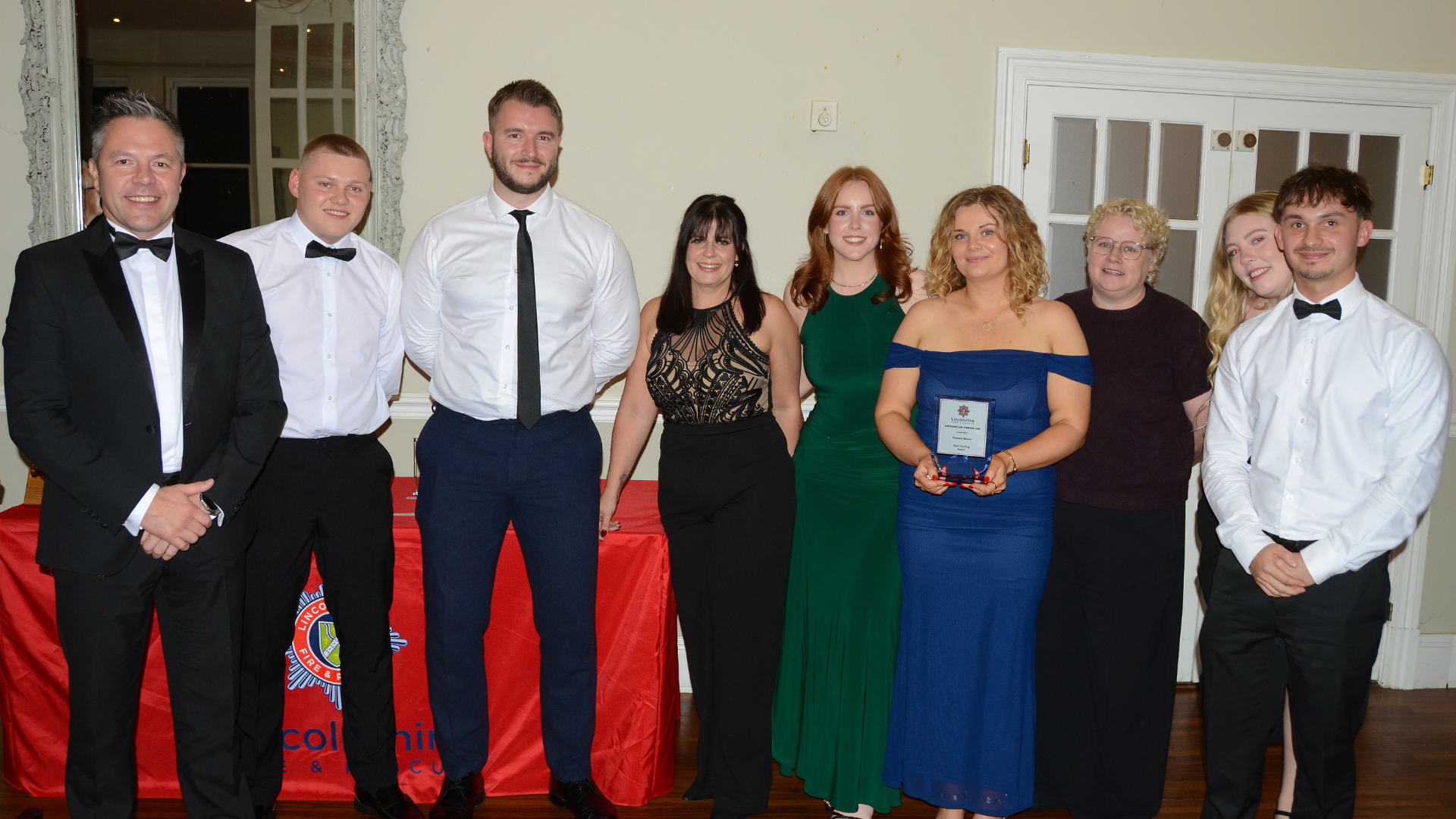 several people posing with award