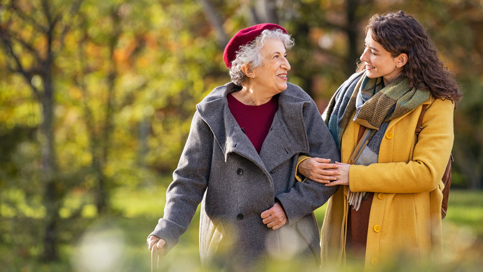 older woman walking with a younger woman