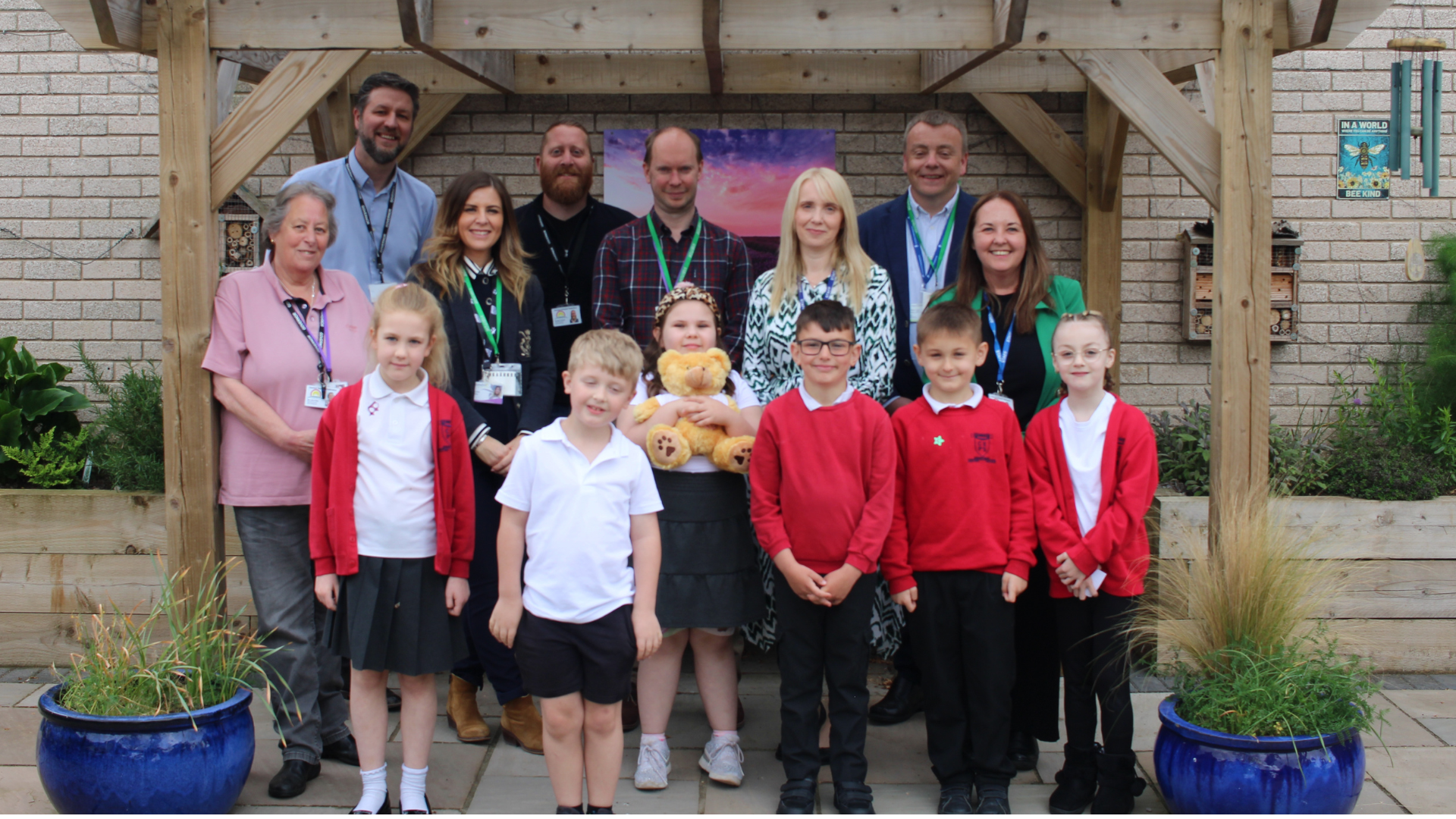 A group photo taking during a visit to Donington Cowley Endowed Primary School