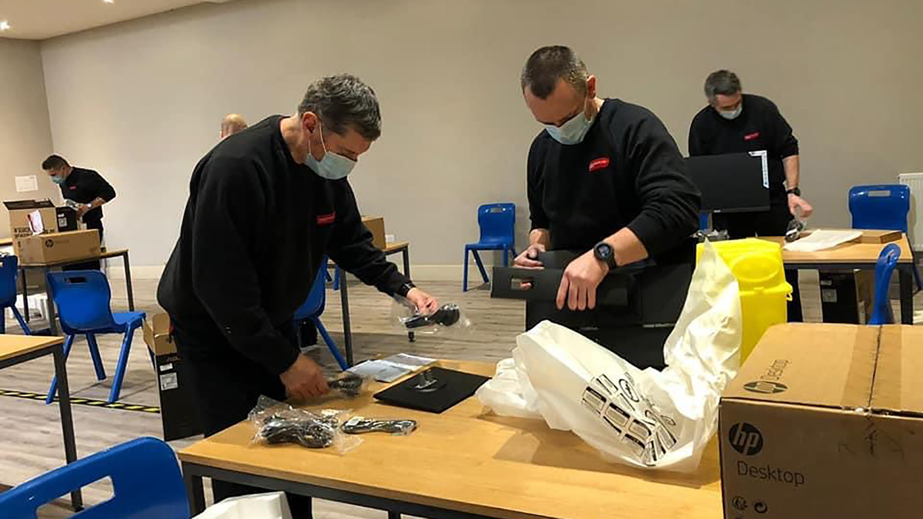 Fire staff helping at a vaccination centre.