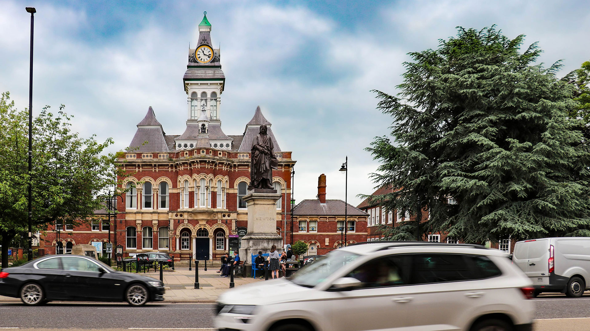 Grantham town centre, with a car passing by the monument