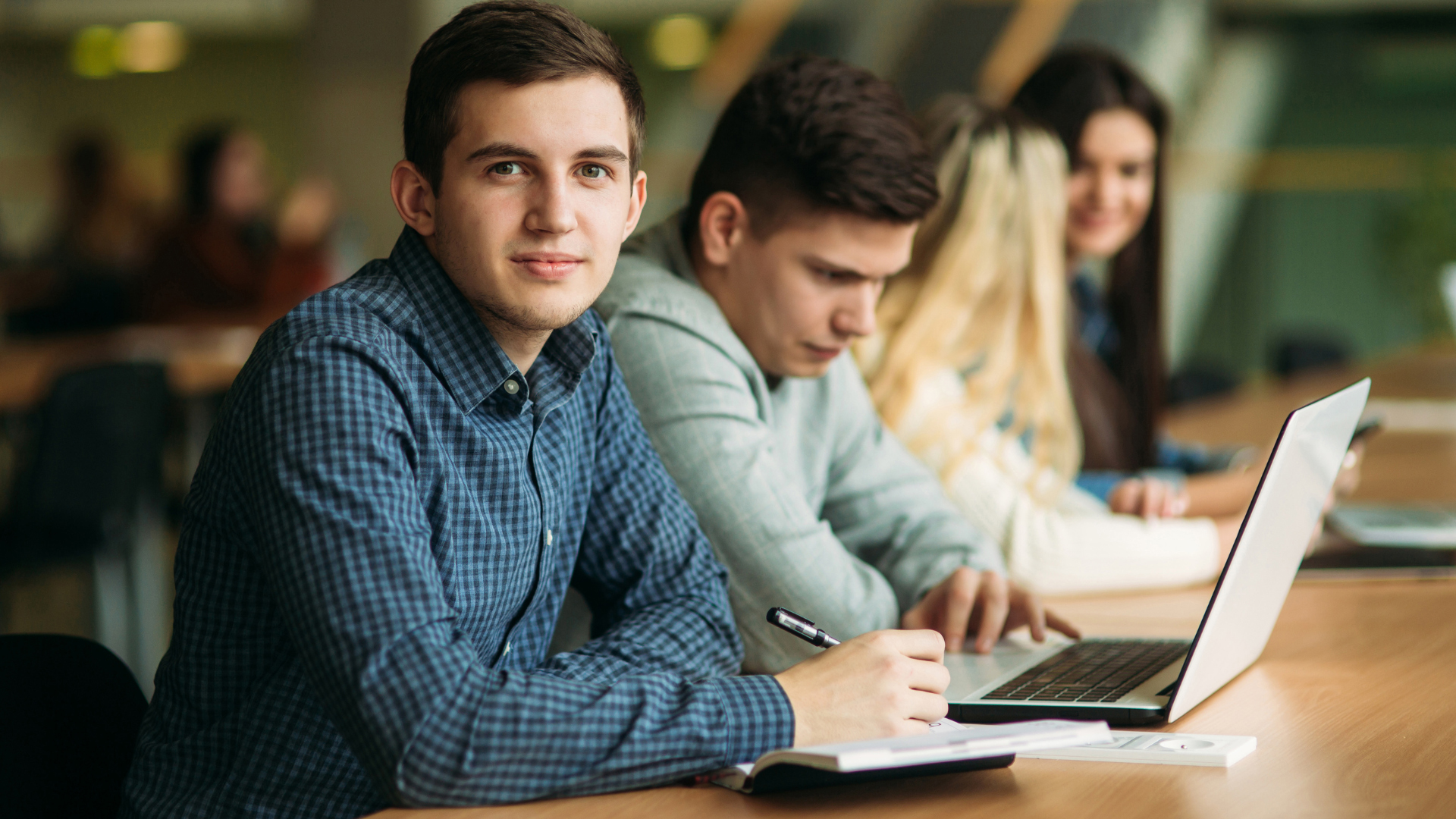 A male student on his laptop