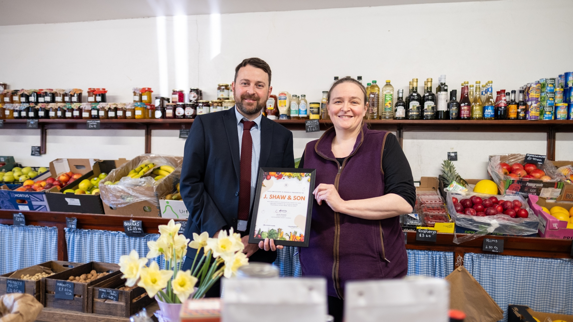 Chris Yorston, head of waste at Lincolnshire County Council, presents Cat Shaw, co-owner, J. Shaw & Son with her certificate