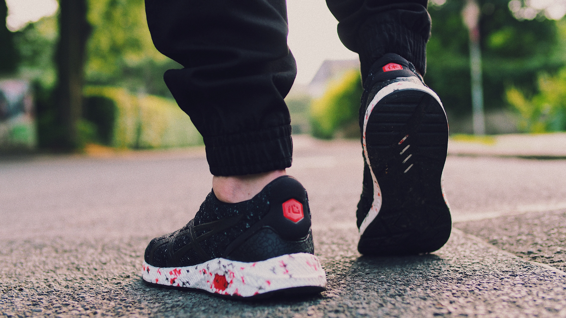Close-up of walking shoes on pavement