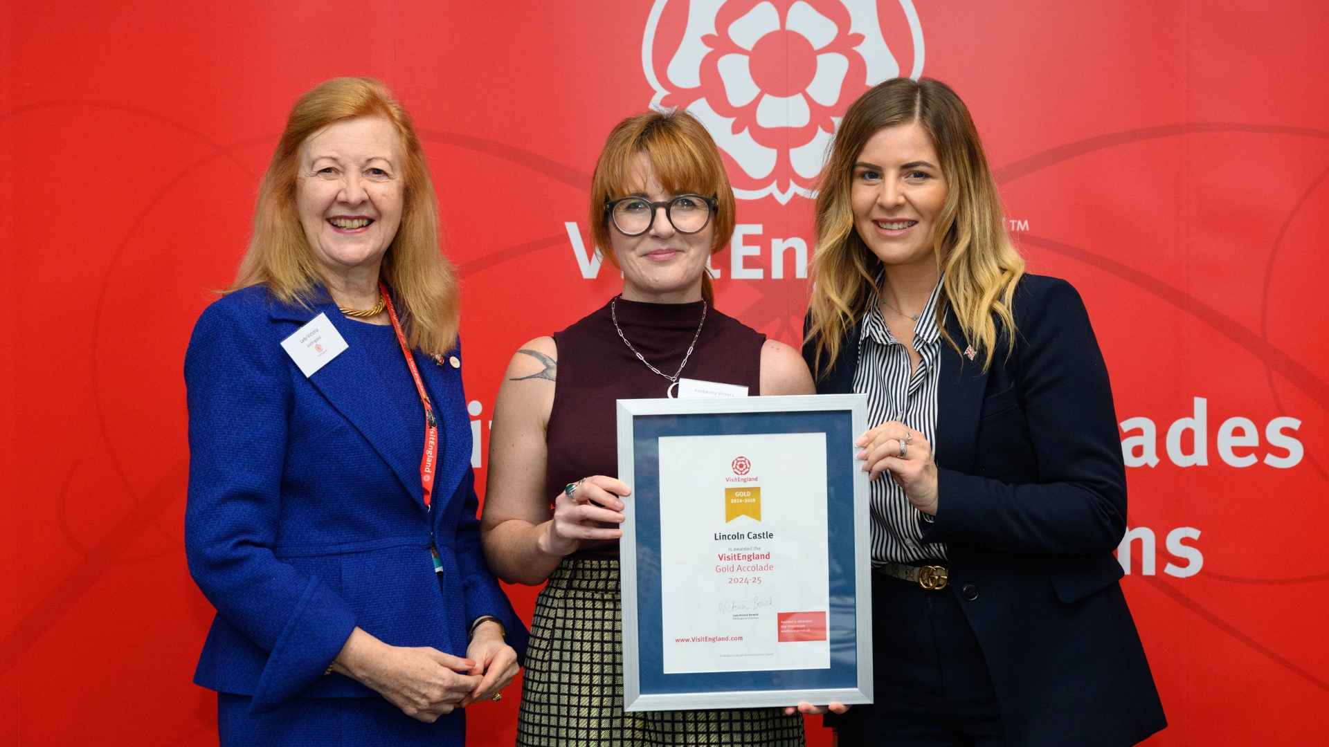 Pictured from left to right, Lady Victoria Borwick presents Kim Vickers, and Cllr Natalie Oliver with the VisitEngland Gold Accolade