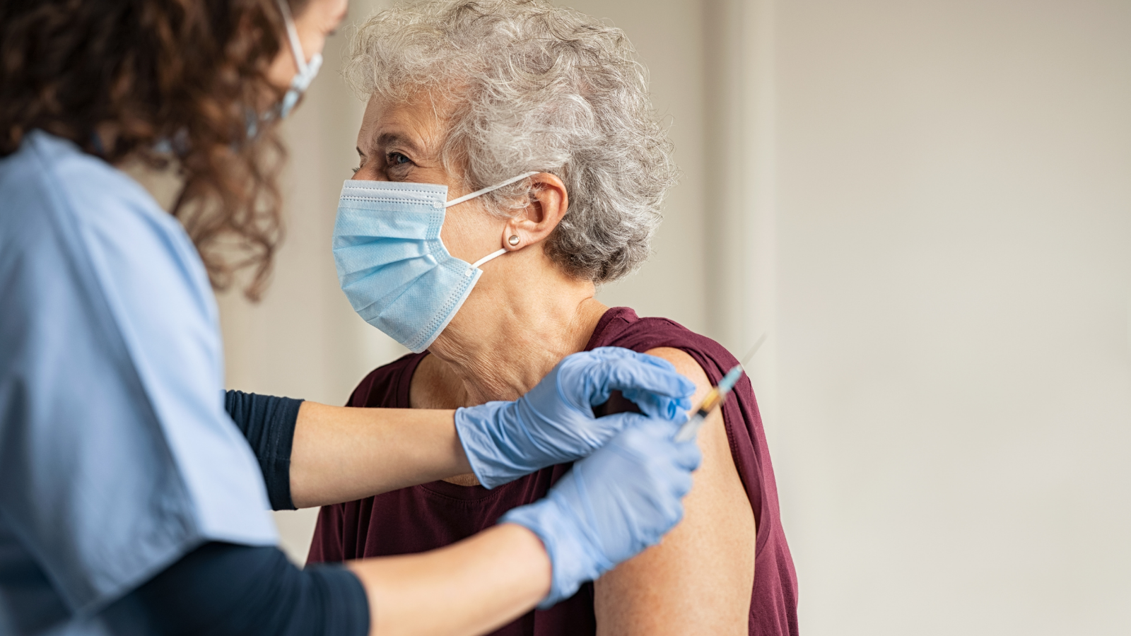 Image of a woman getting the covid vaccine