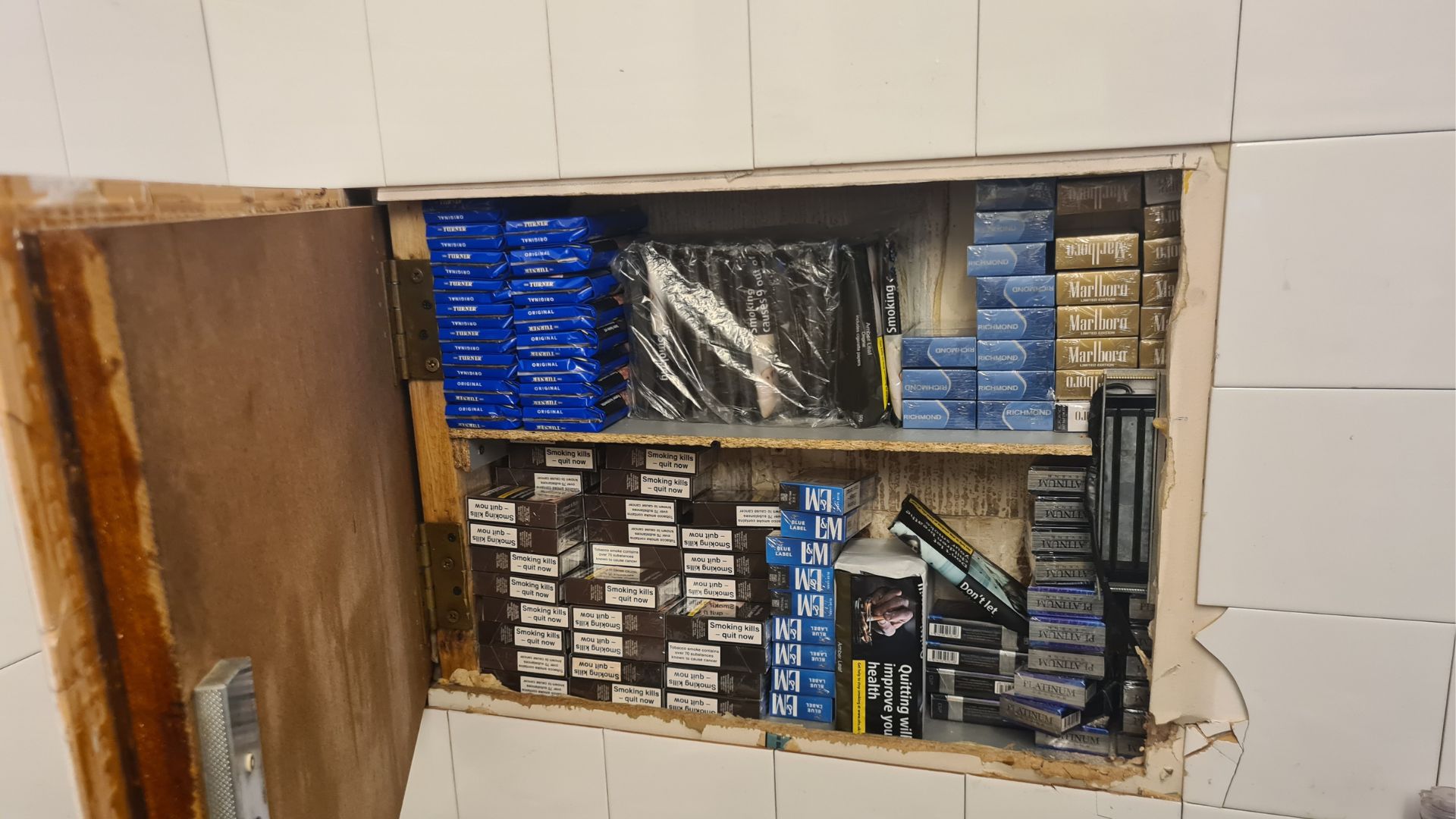 Illegal cigarettes hidden behind a tiled wall at Easy Shop & Vape Shop, 5A Lumley Road, Skegness