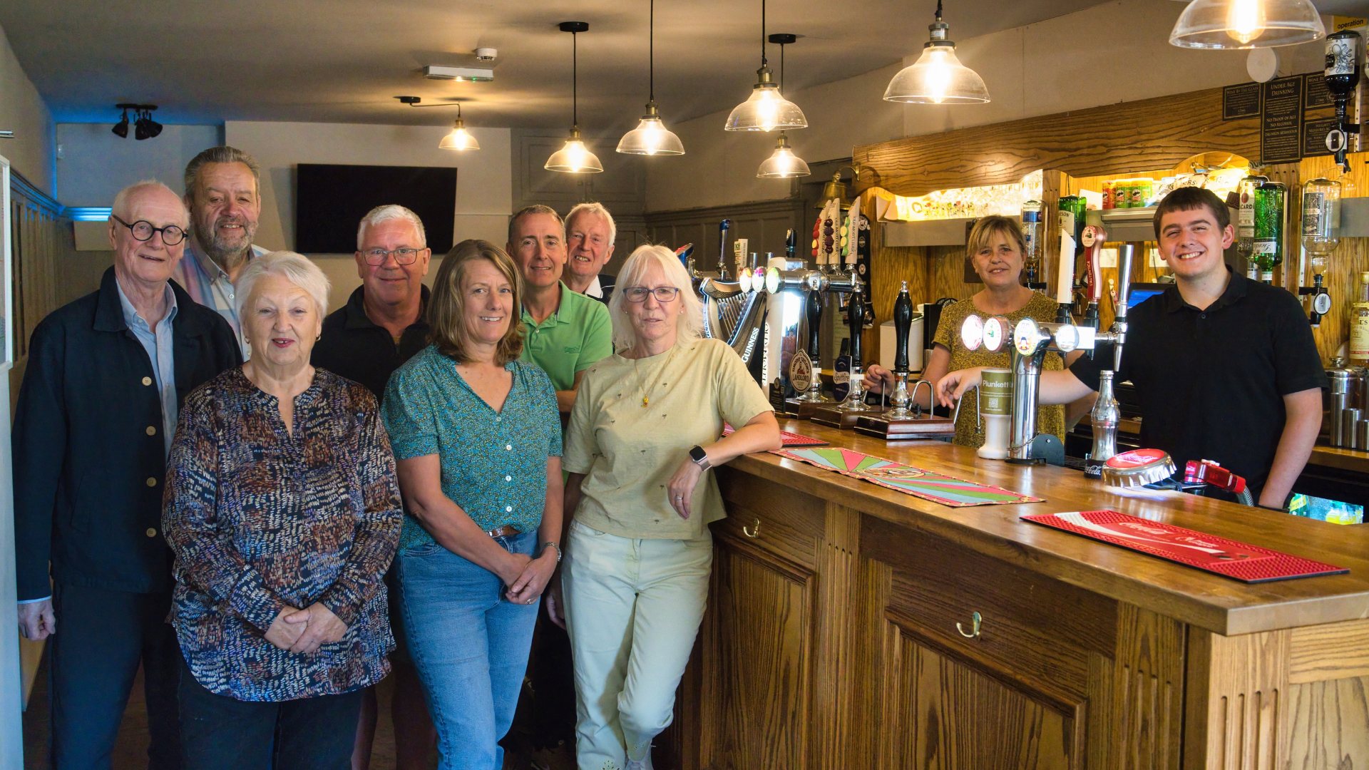 A group of volunteers with county councillor Ken Bamford in the bar of the Thorold pub.