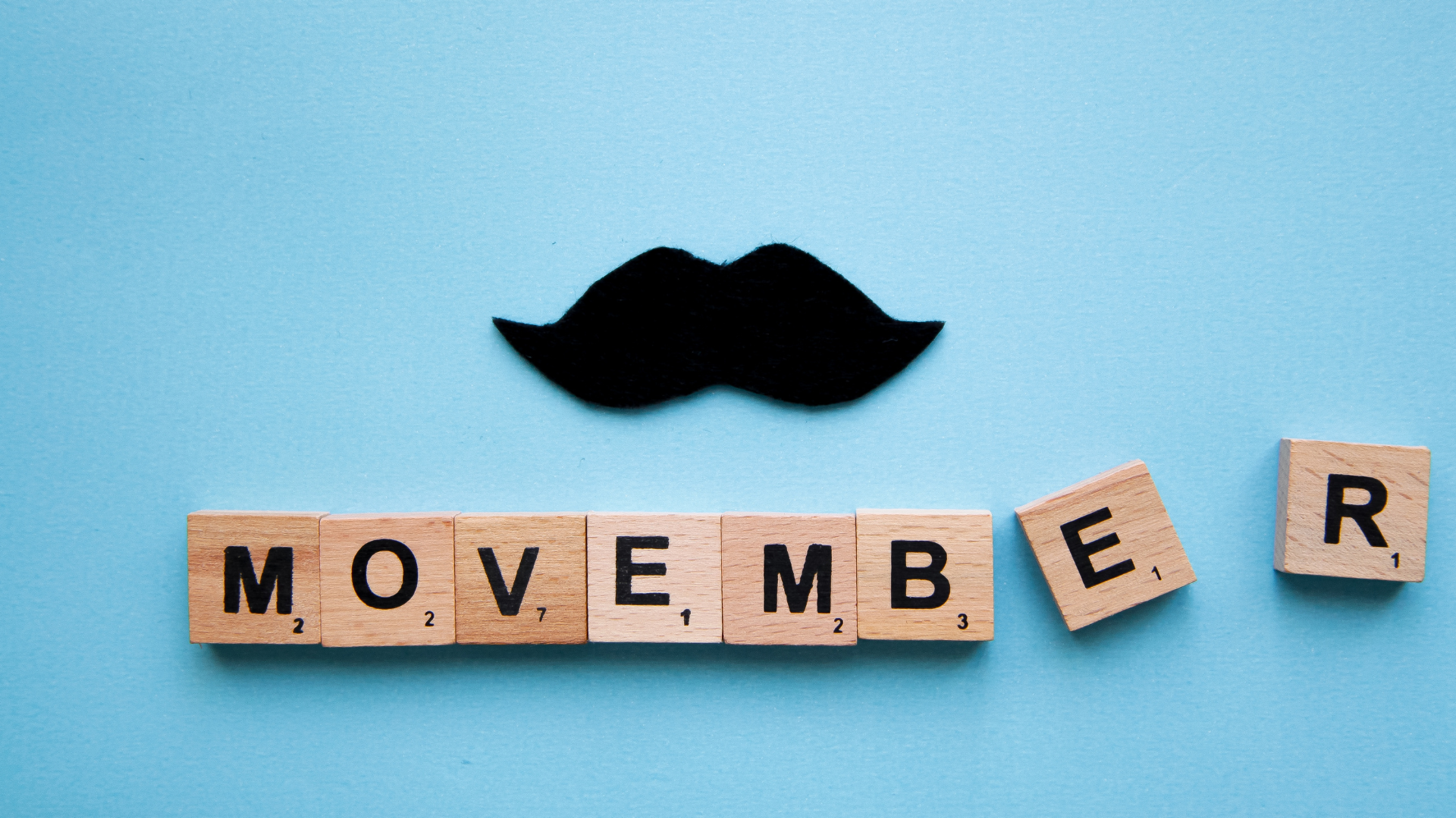Moustache with Movember written beneath