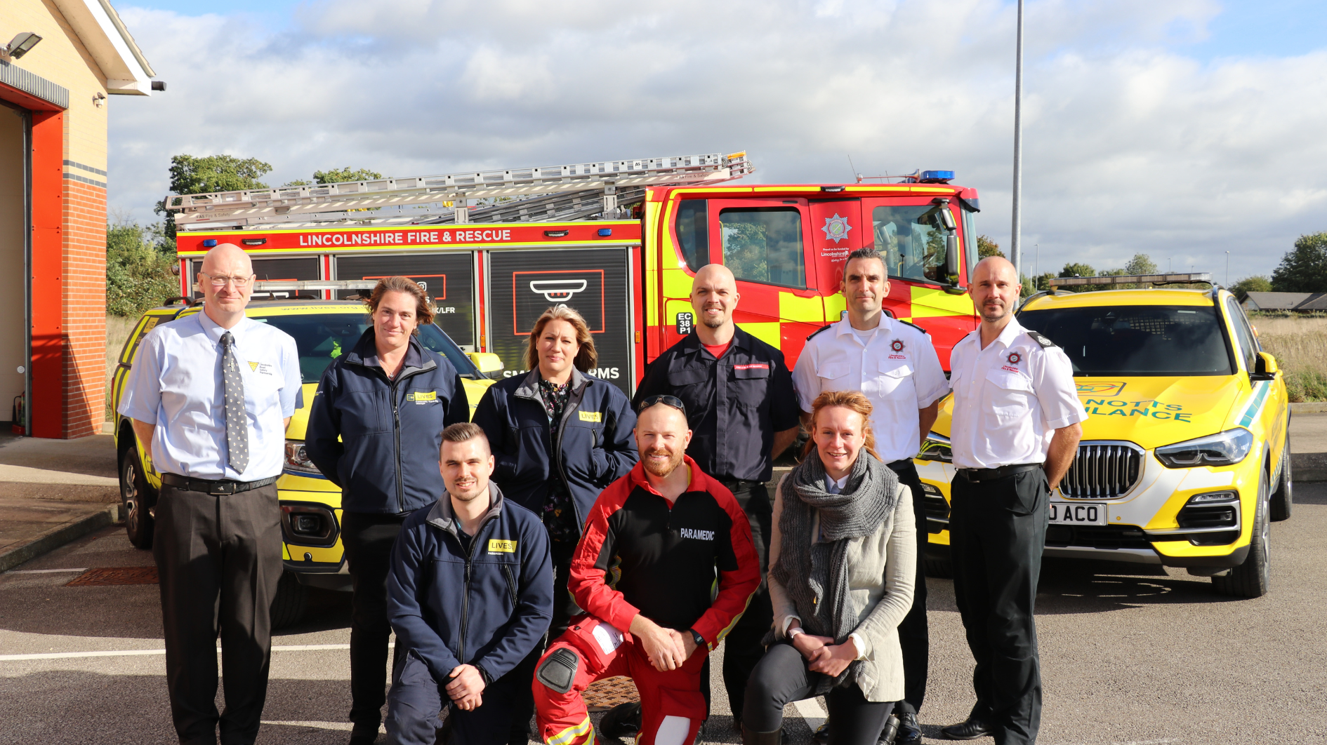 Lincolnshire Fire and Rescue vehicle with two emergency response vehicles parked side by side. People stood in front of these vehicles