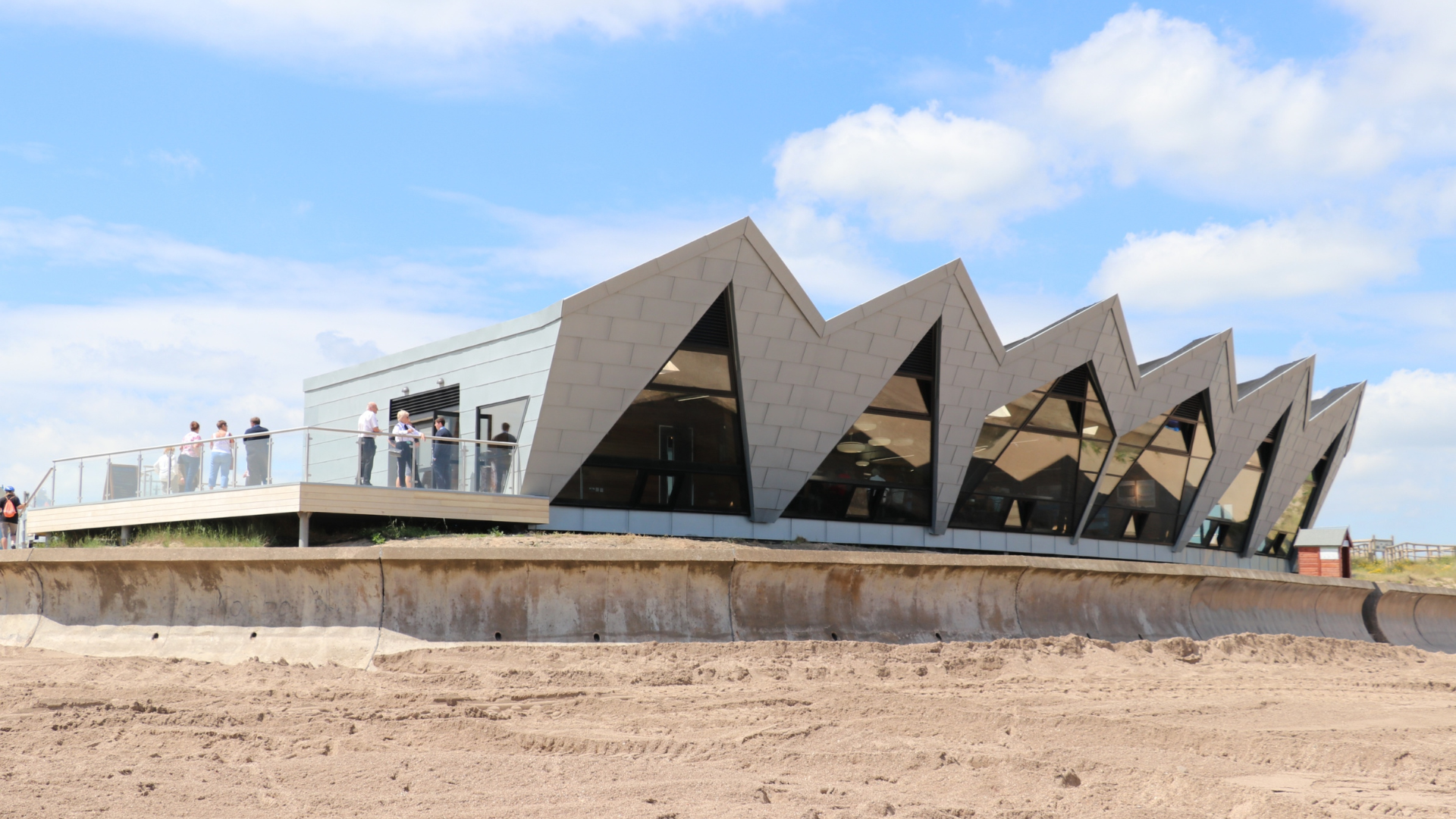 A observatory building made out of wood overlooking the beach