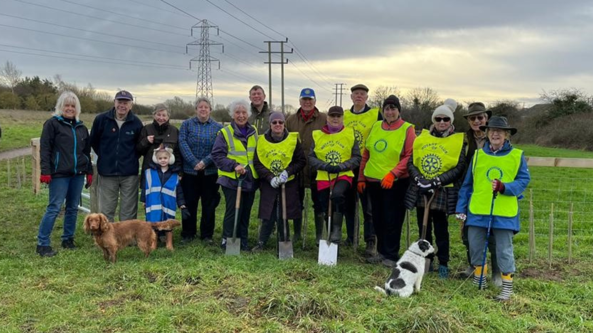 A group of volunteers in high visibility vests work wear at Mareham Pastures