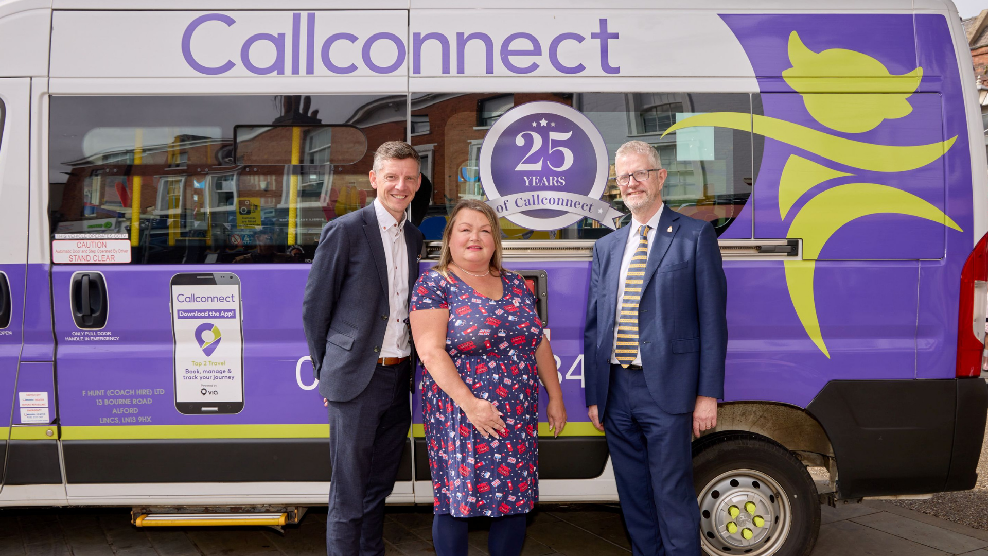 three people stood in front of callconnect bus