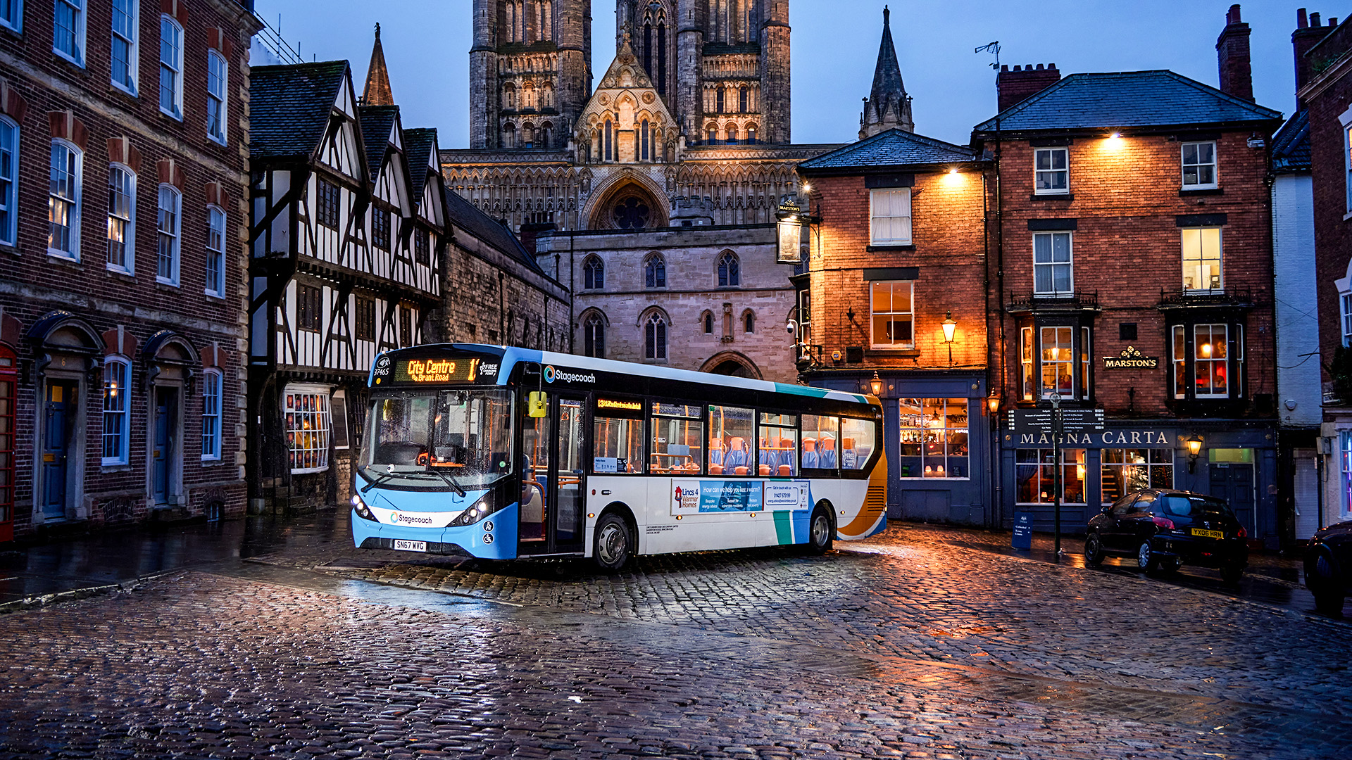 Night time bus at night cathedral photo