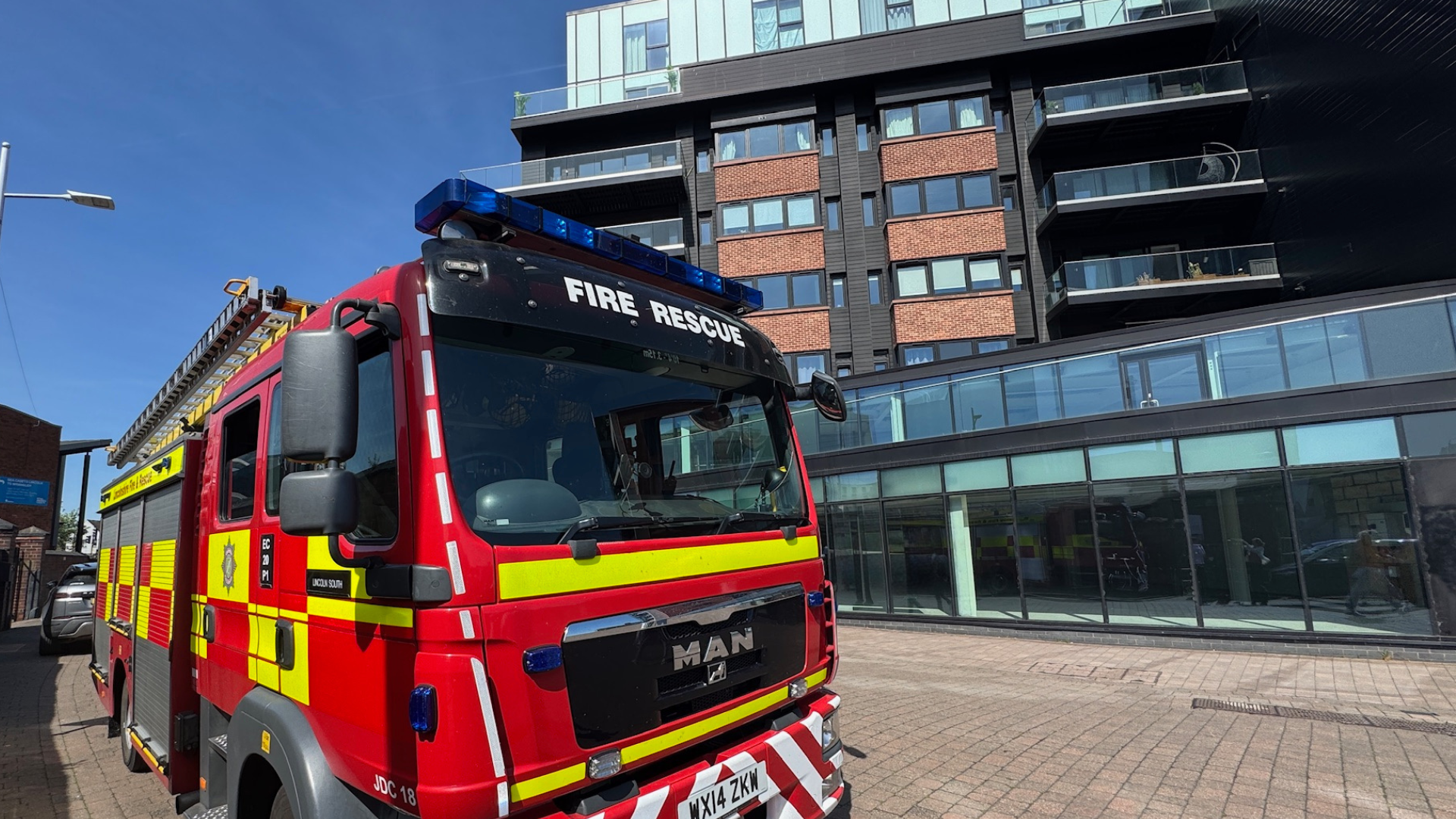 A fire engine outside an apartment block called One The Brayford