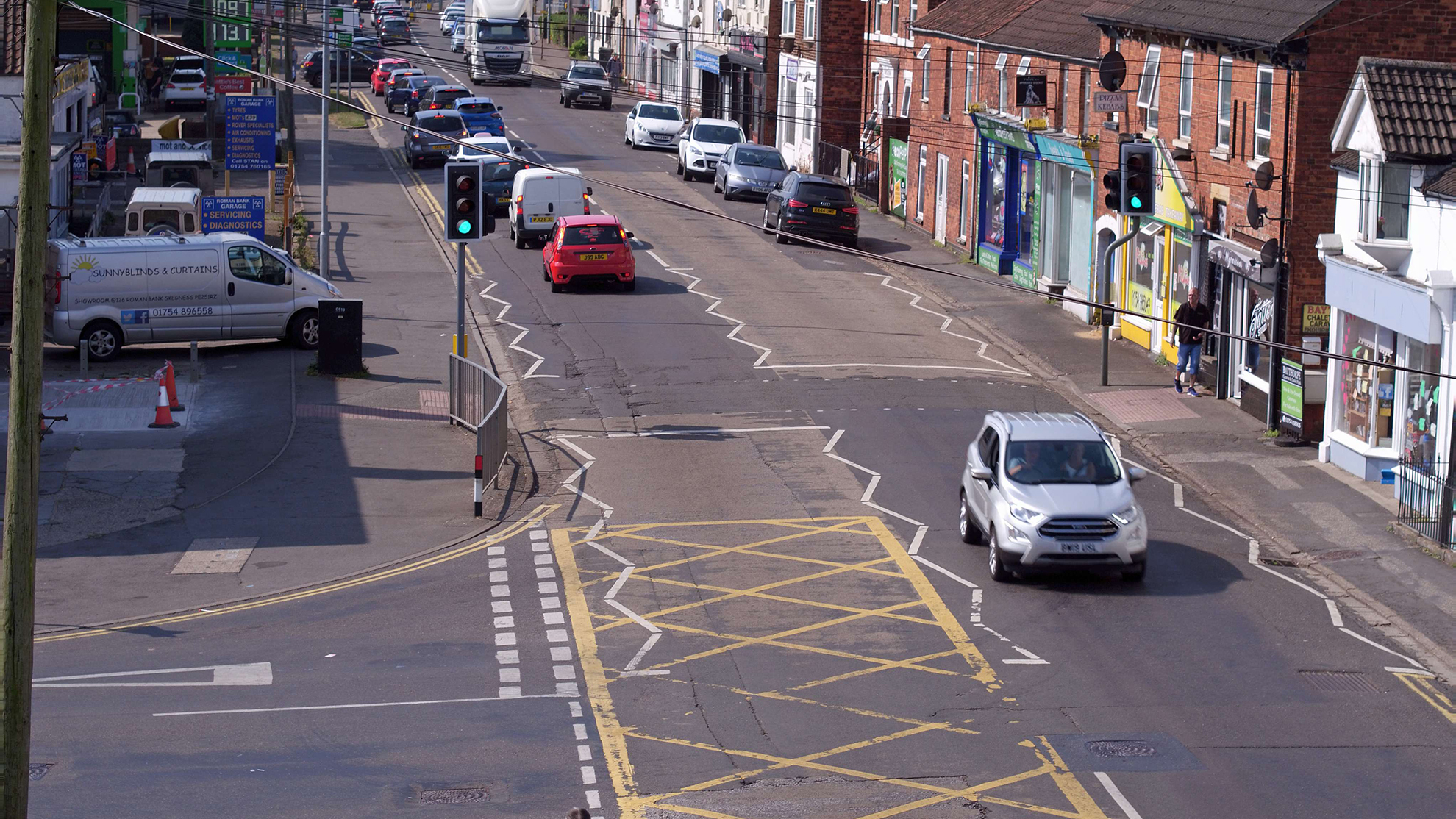 Photo of Roman Bank in Skegness, with tourists and cars using the road.