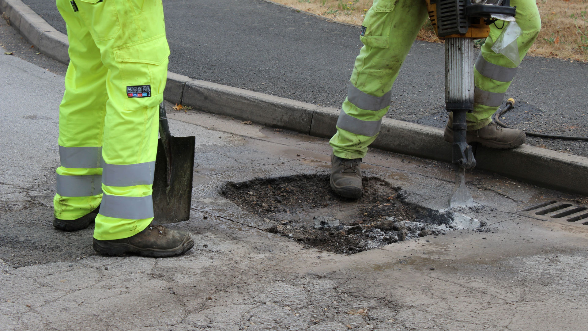 Highway repairing a pot hole in a road