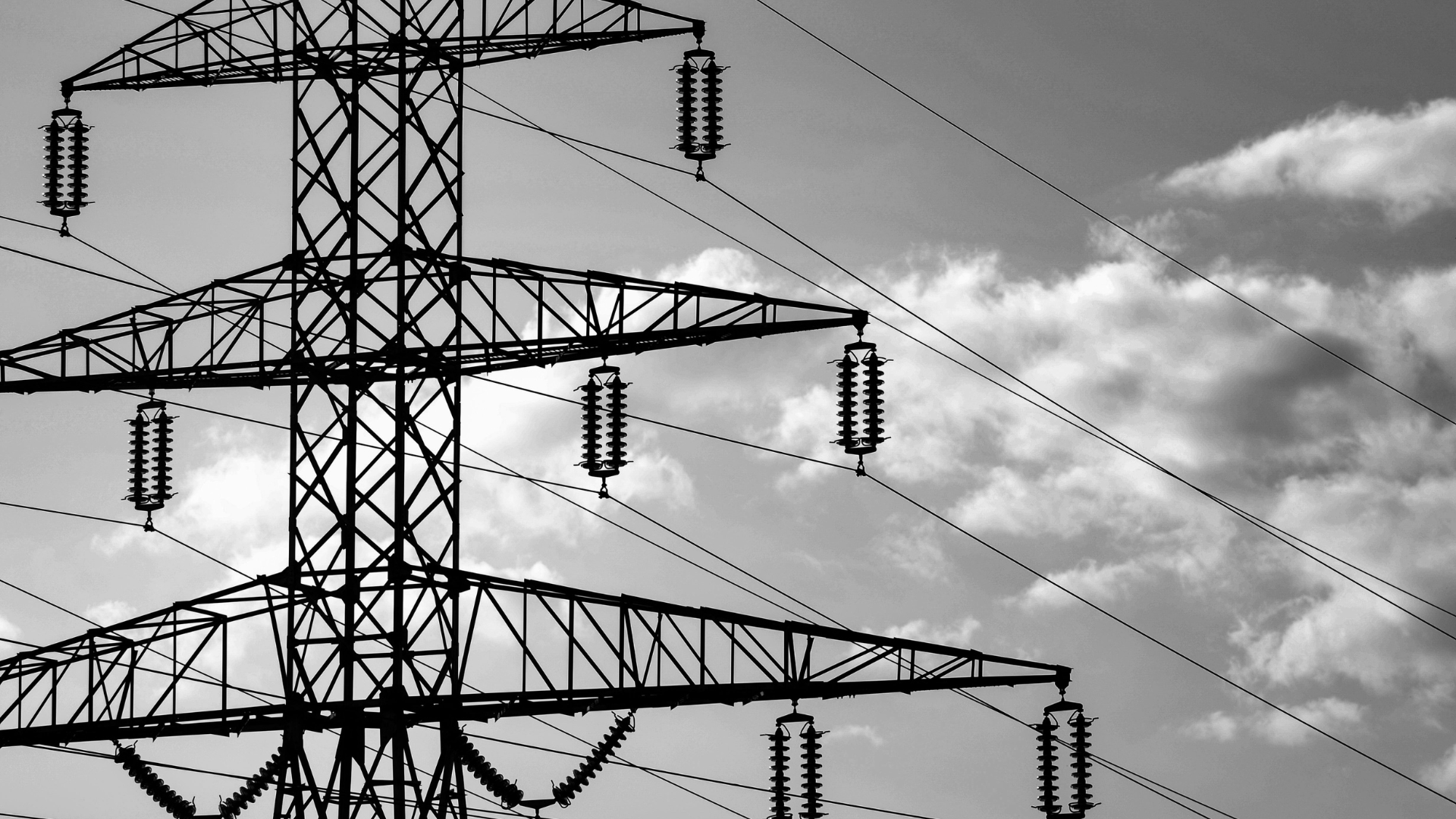 Pylons with a cloudy sky behind them