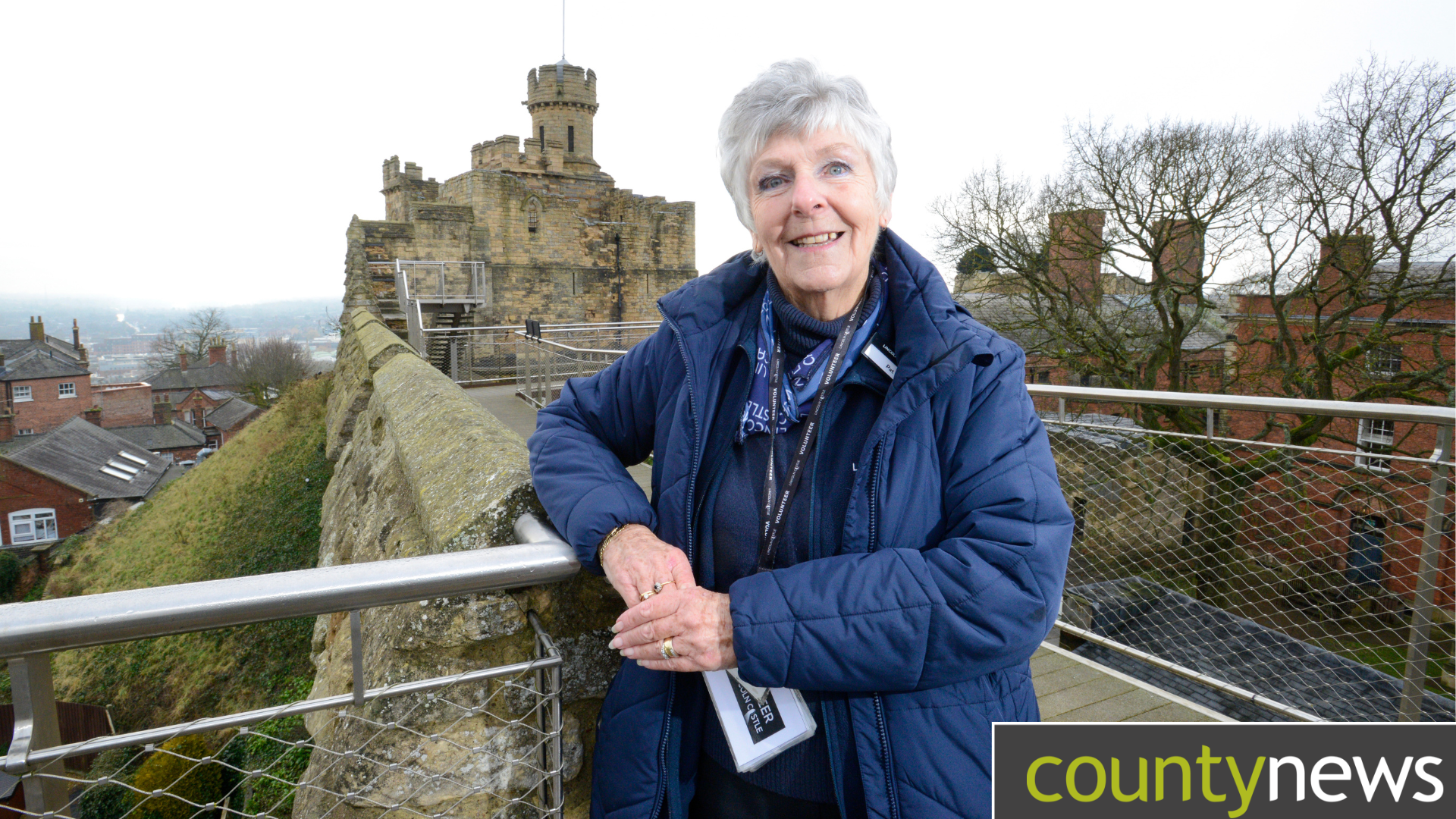 Volunteer Pat welcomes visitors to Lincoln Castle