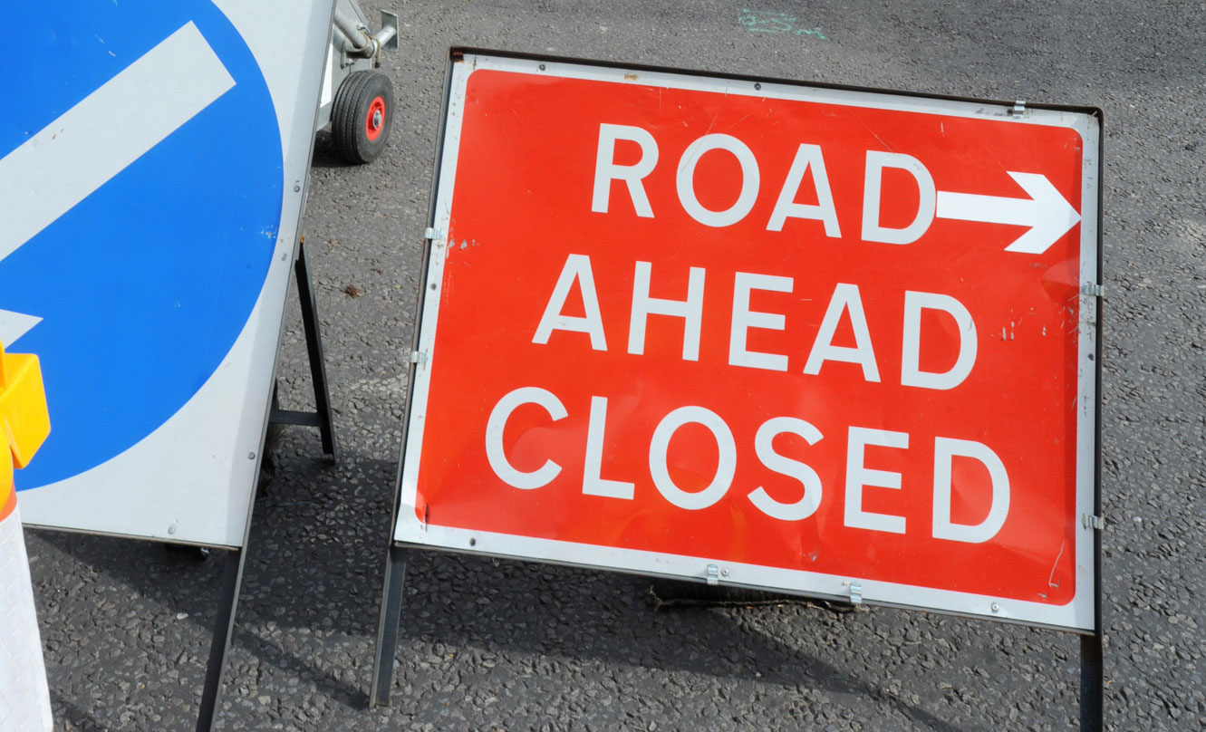 Road ahead closed sign.