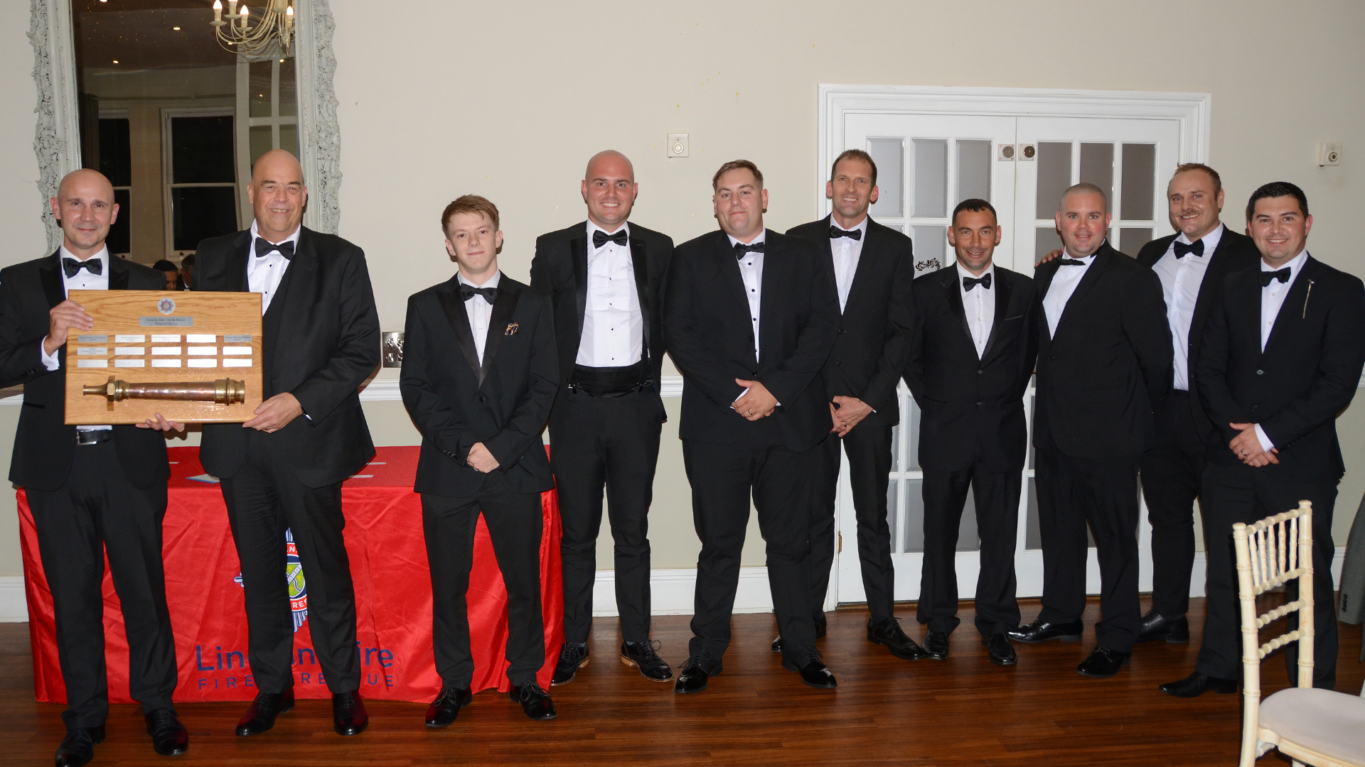 several people posing with award