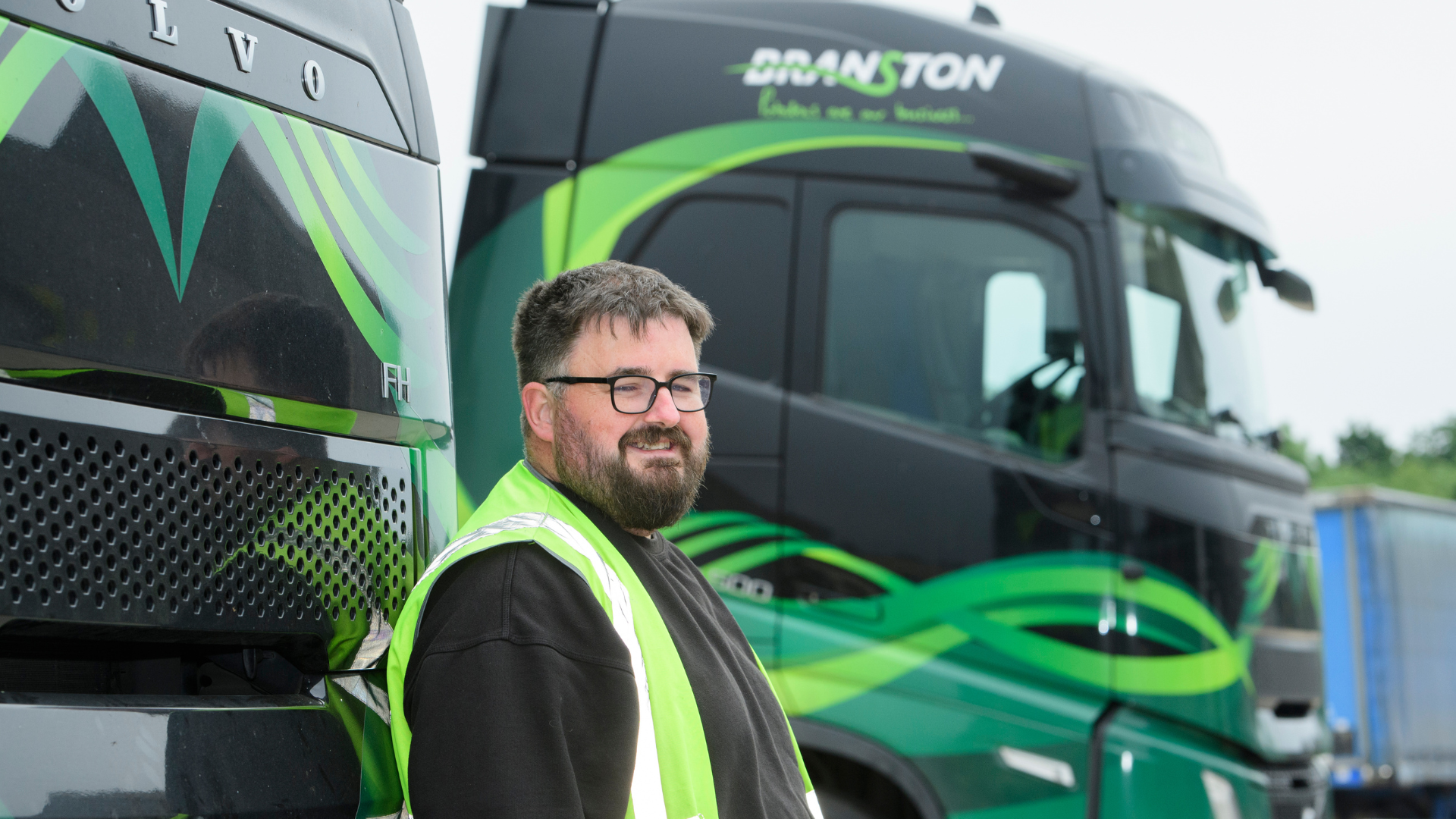 man in front of lorry