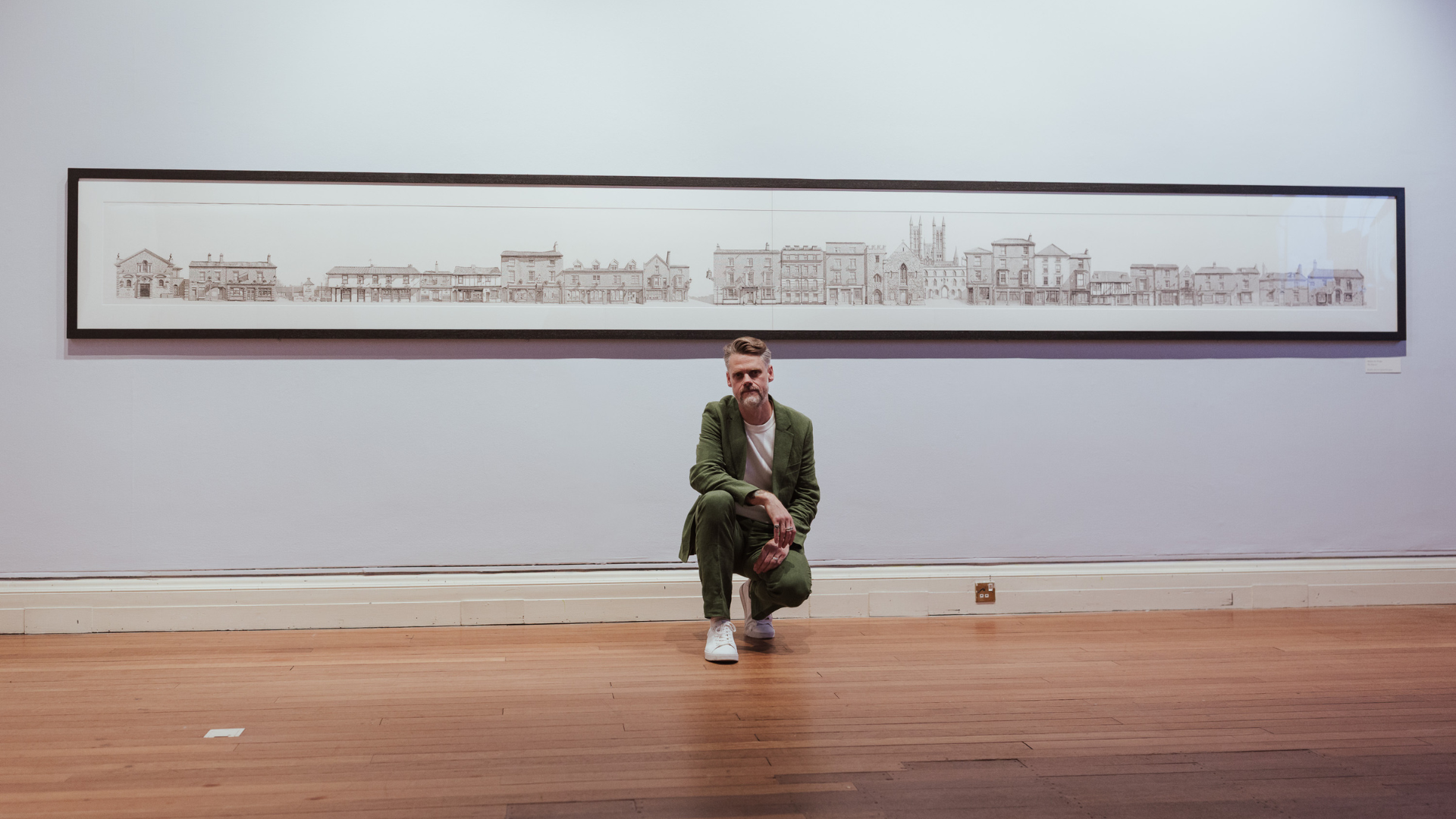 Matthew D. Wright stands in front of The Papestry