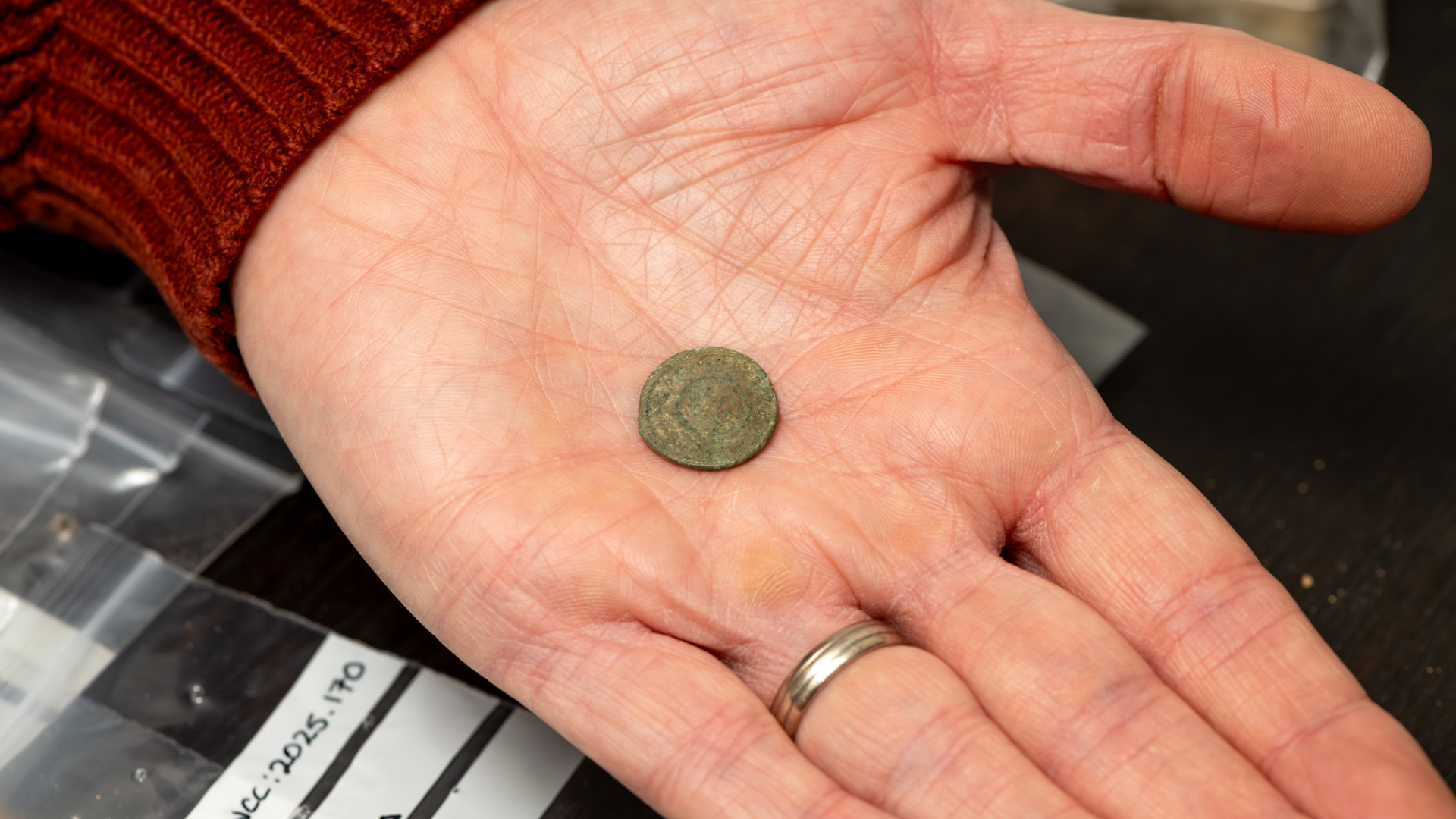 Roman coin in the palm of hand