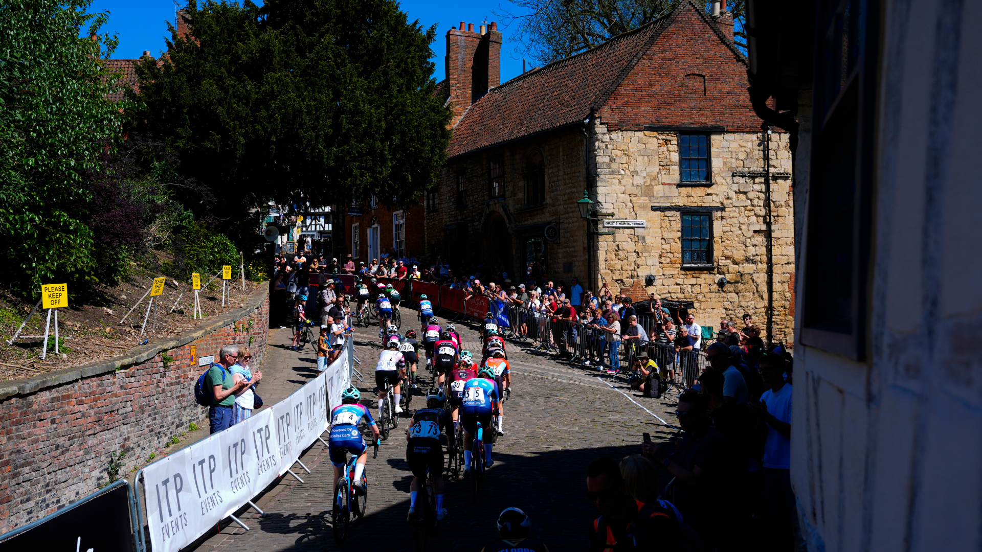 Cyclists ride up Steep Hill in Lincoln